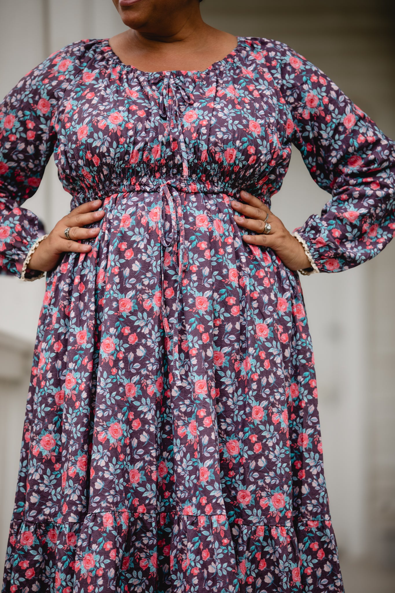 Woman in modest nursing floral dress outdoors