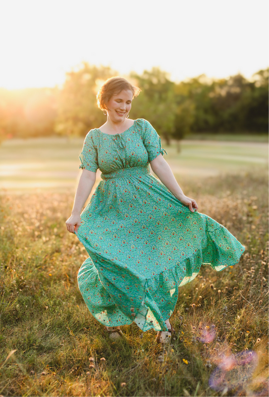 woman wearing a modest nursing green dress