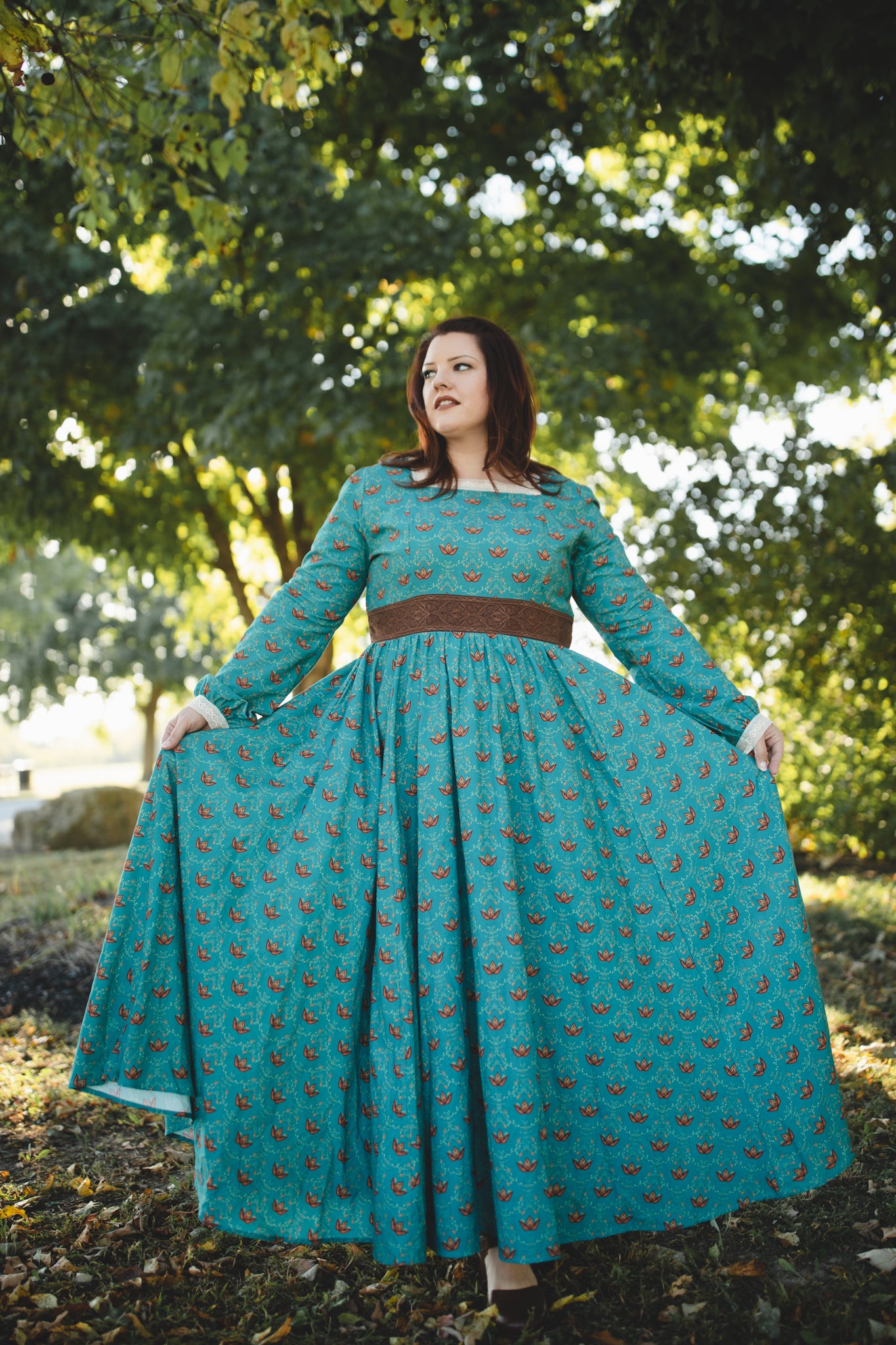Woman in modest nursing teal dress outdoors
