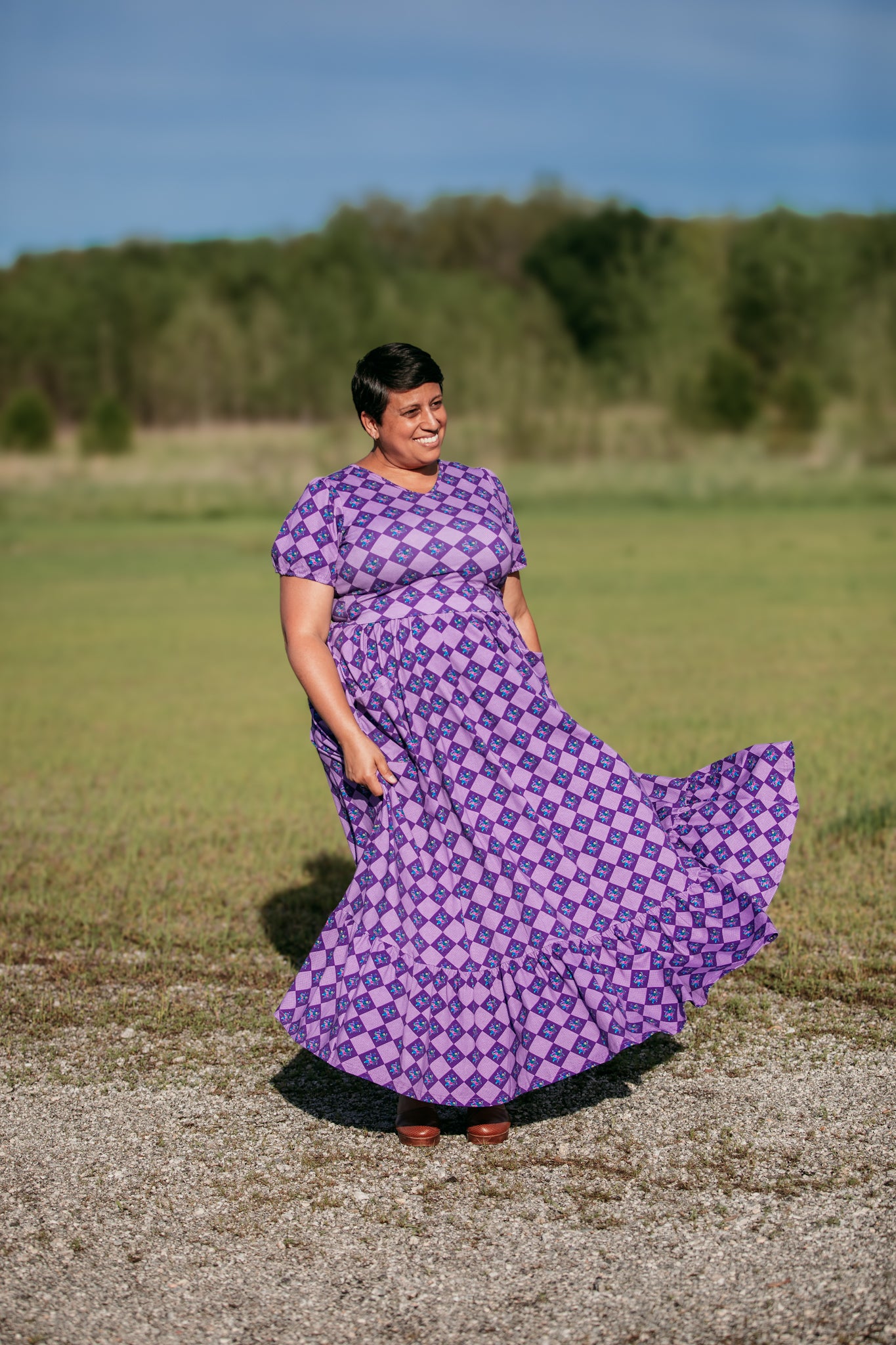 woman wearing patterned purple modest nursing dress