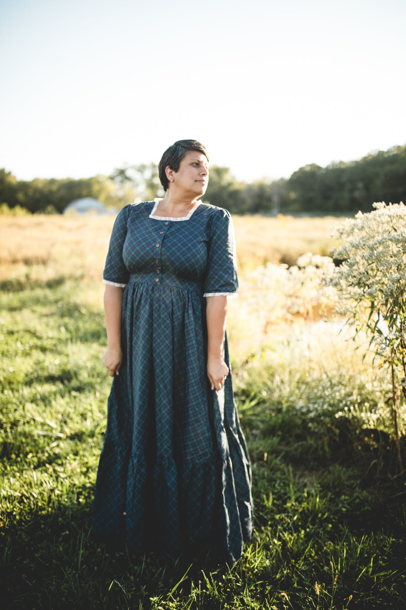 woman wearing a modest nursing blue patterned dress