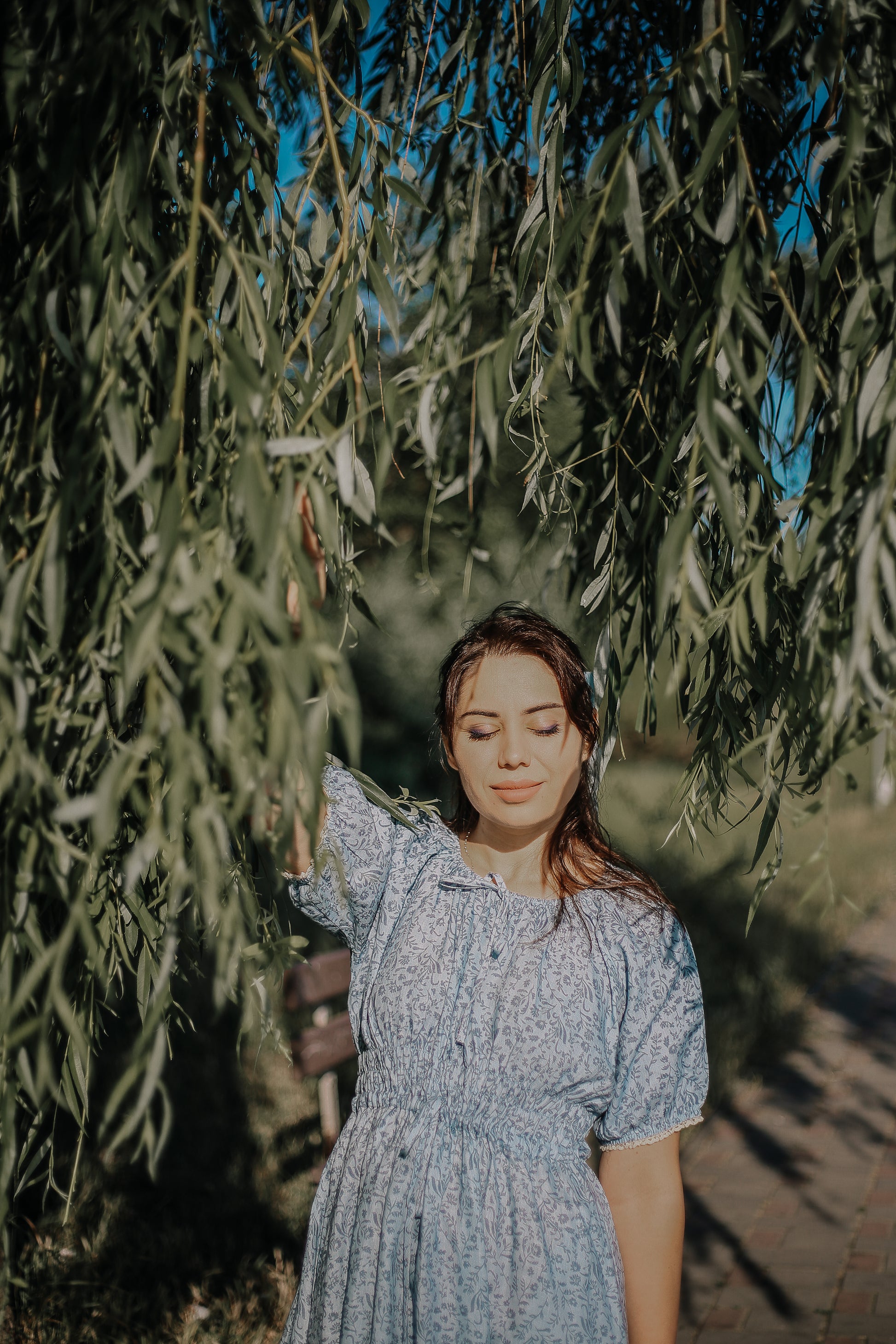 woman in a modest blue nursing dress