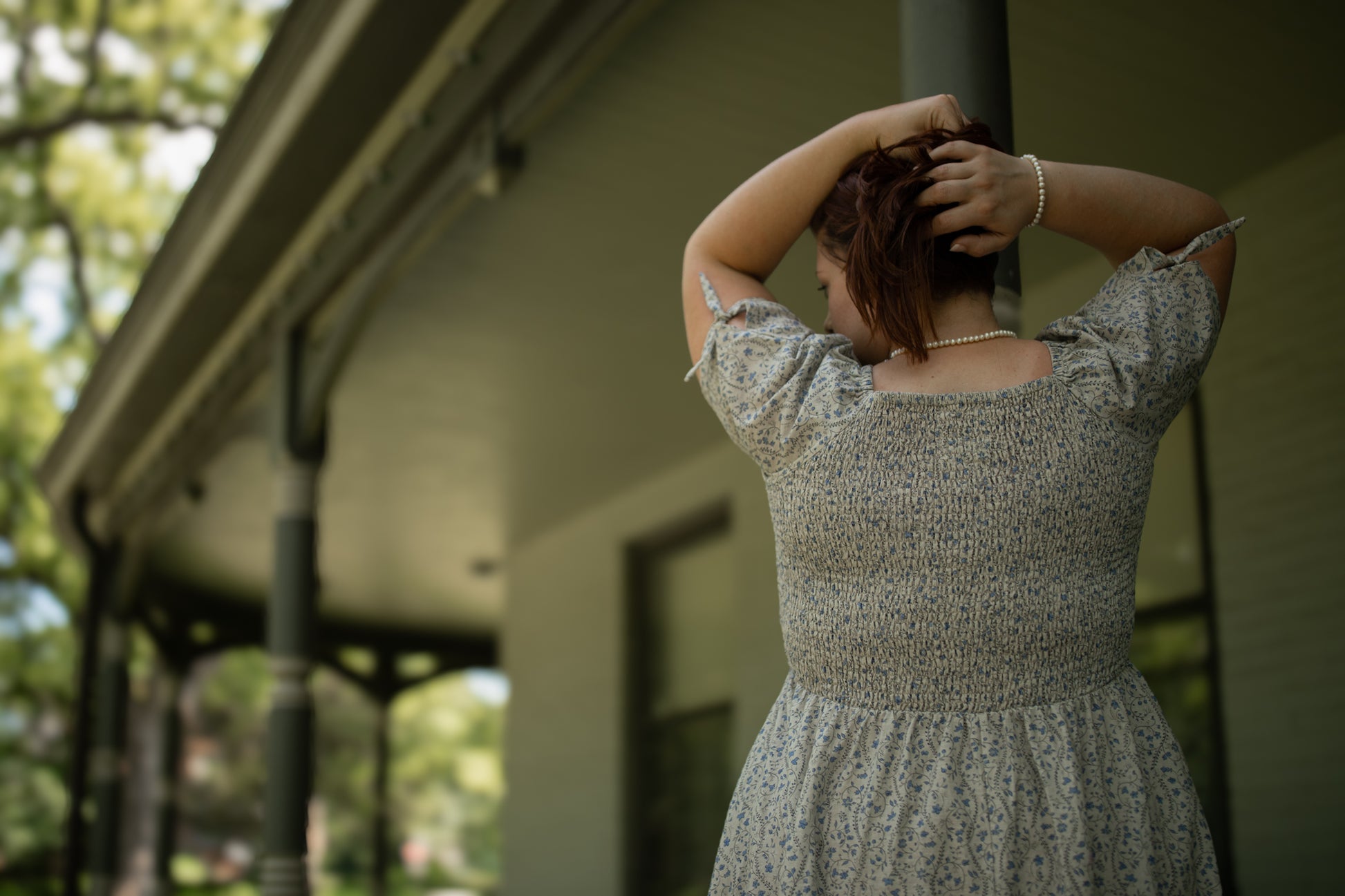 woman in patterned modest nursing dress