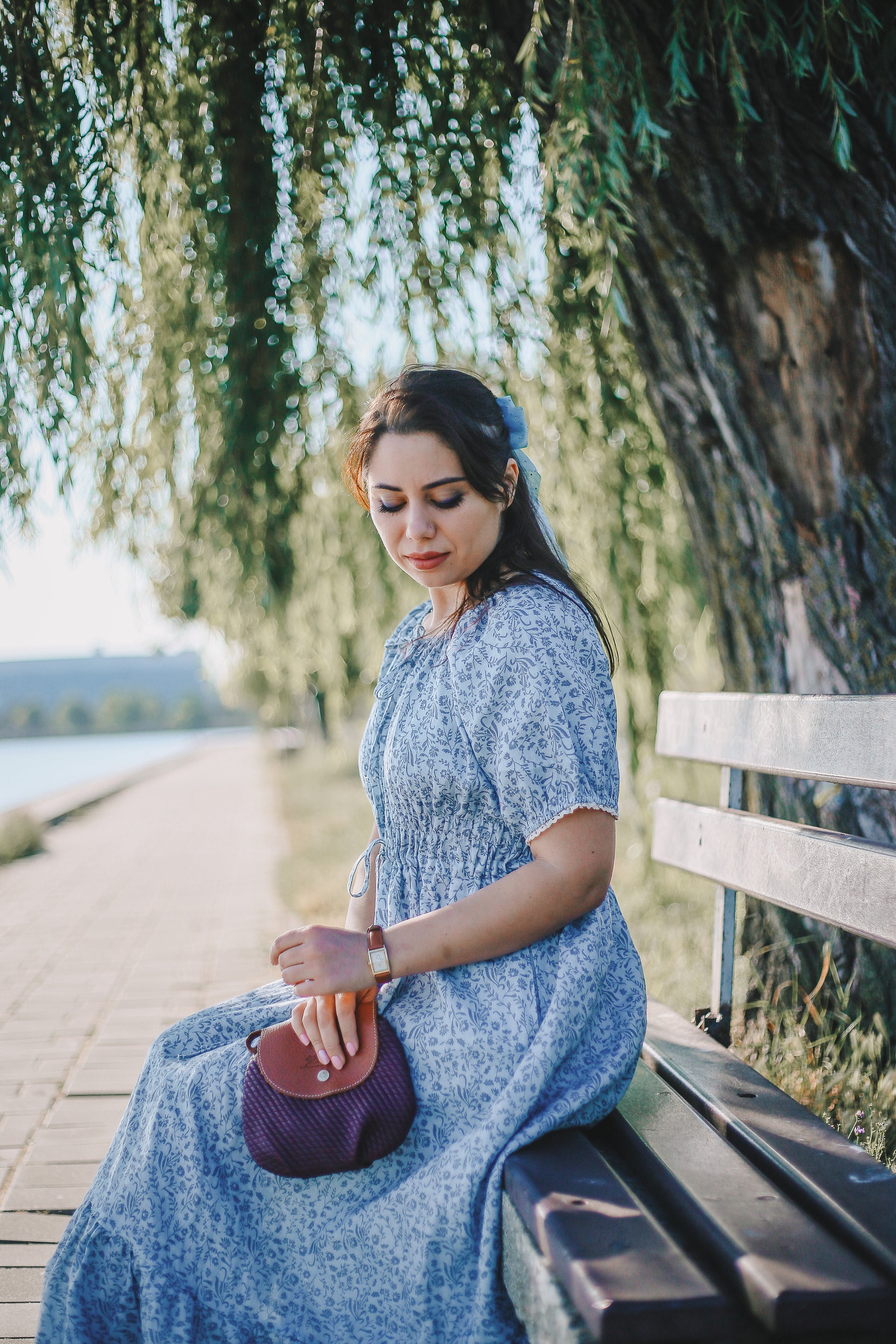 woman in a modest blue nursing dress