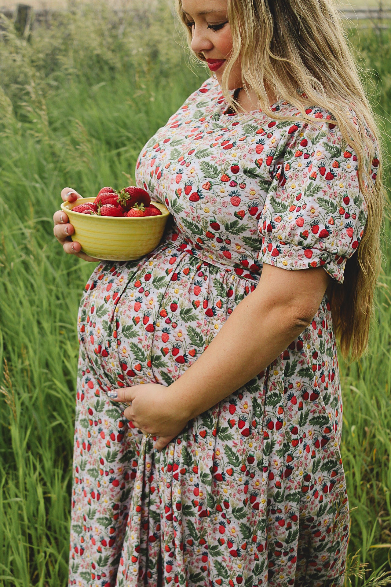 Woman in a floral modest nursing dress.