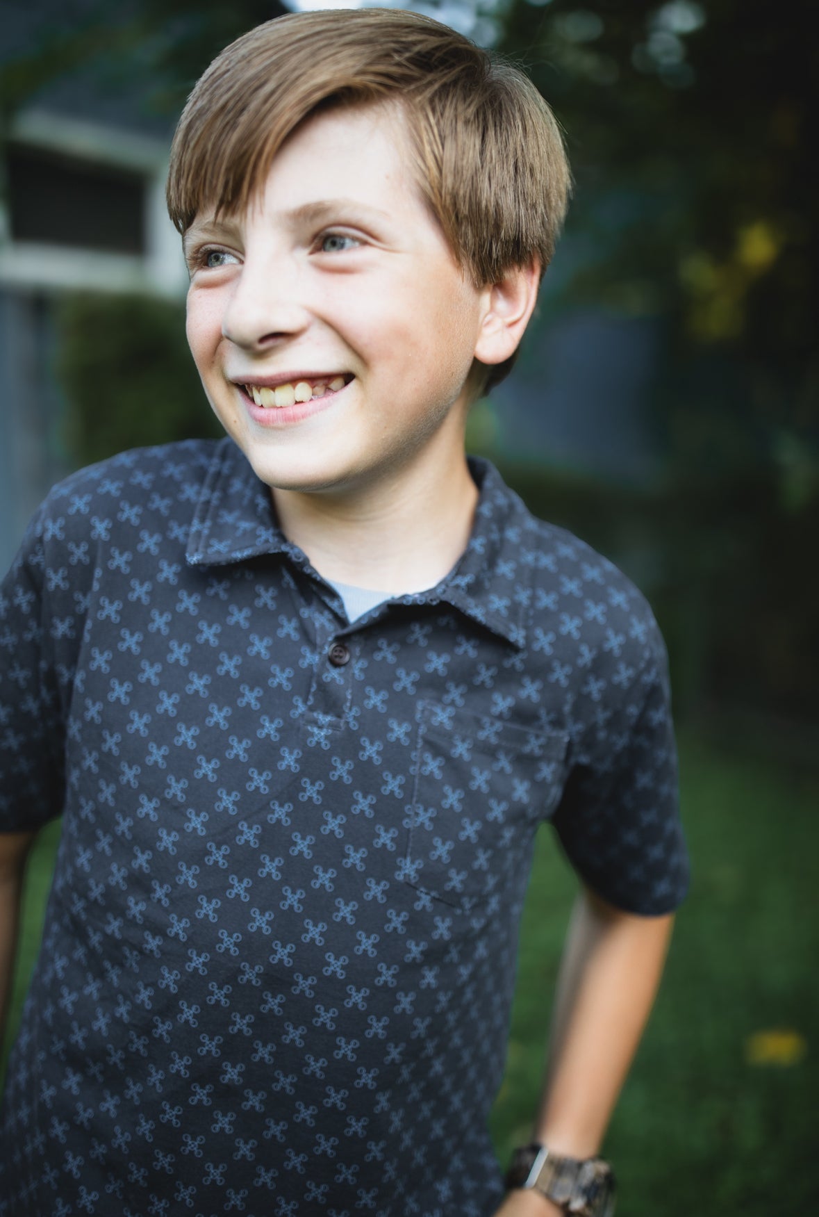 Young boy wearing a dark blue polo shirt