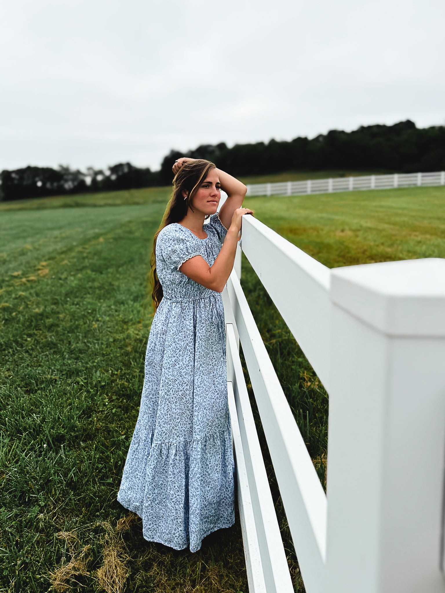 woman in a modest blue nursing dress