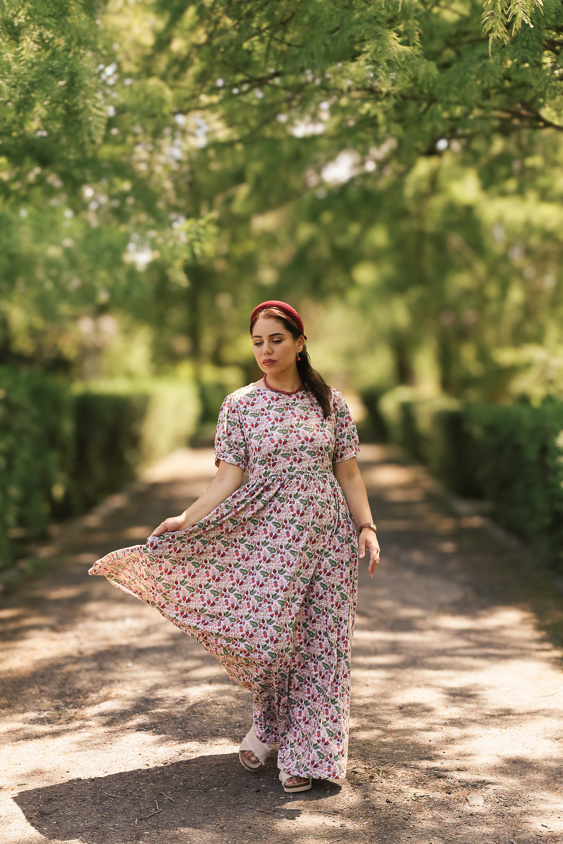 Woman in a floral modest nursing dress.
