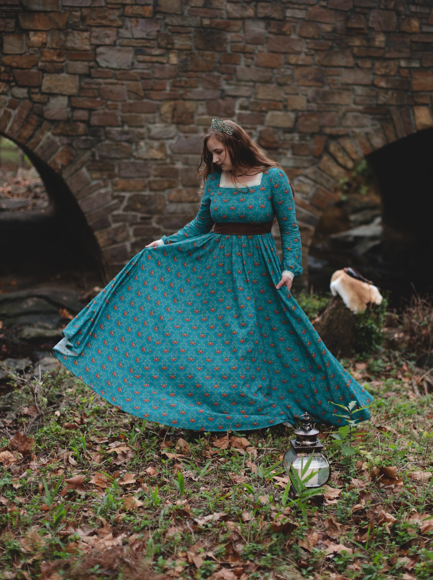 Woman in modest nursing teal dress by archway