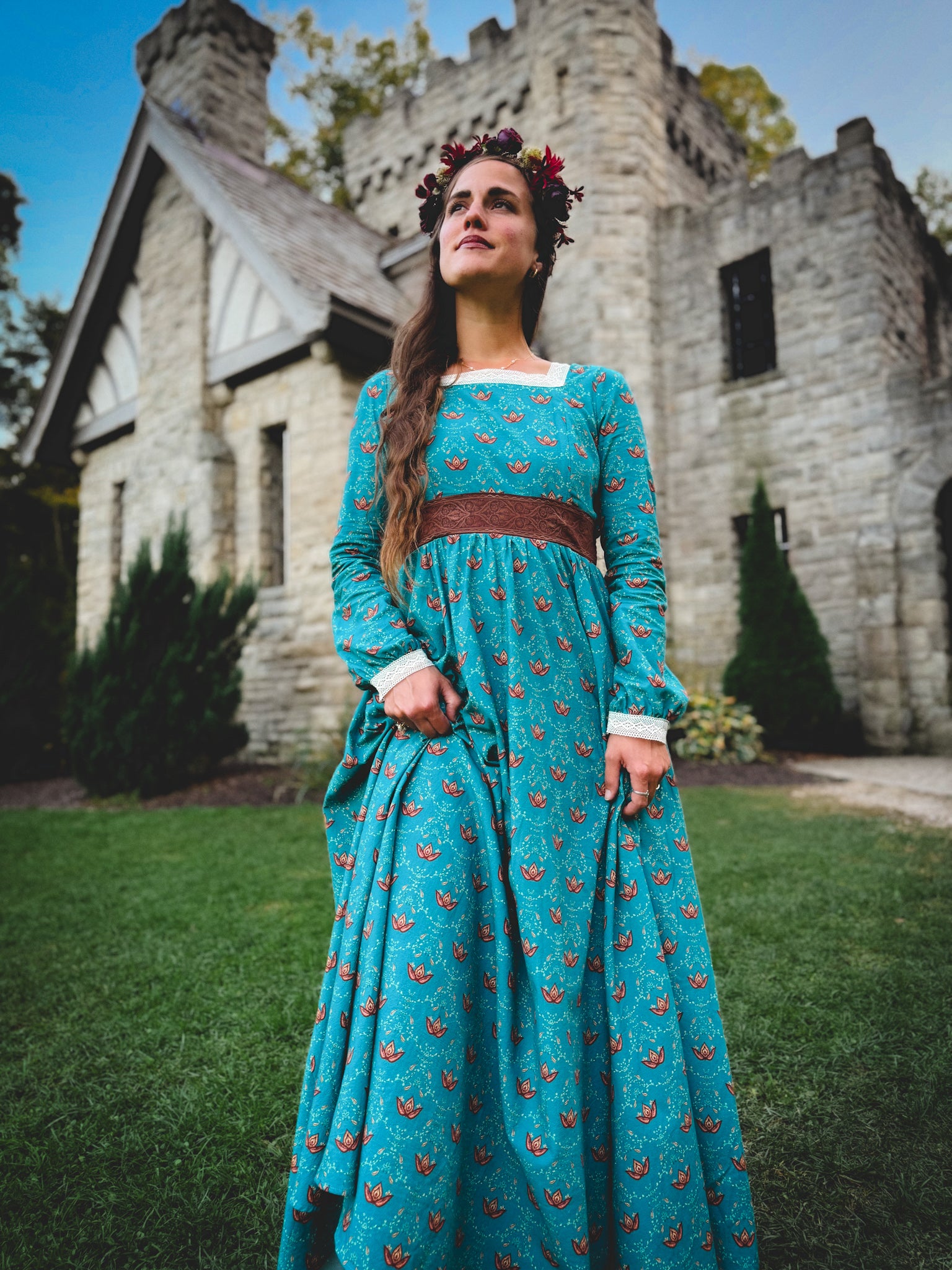 Woman in modest nursing blue dress with belt