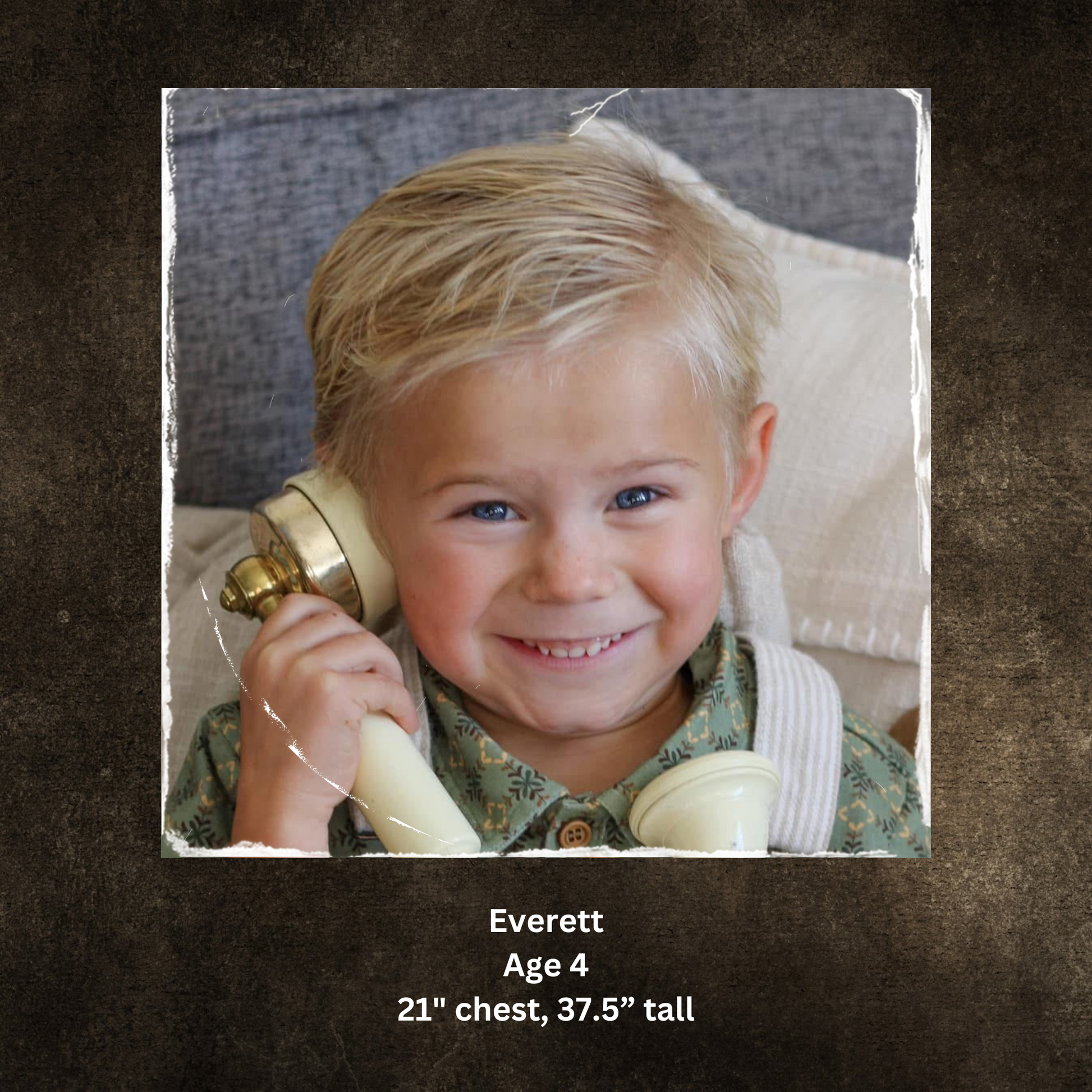 Child holding a toy phone with text indicating name and dimensions