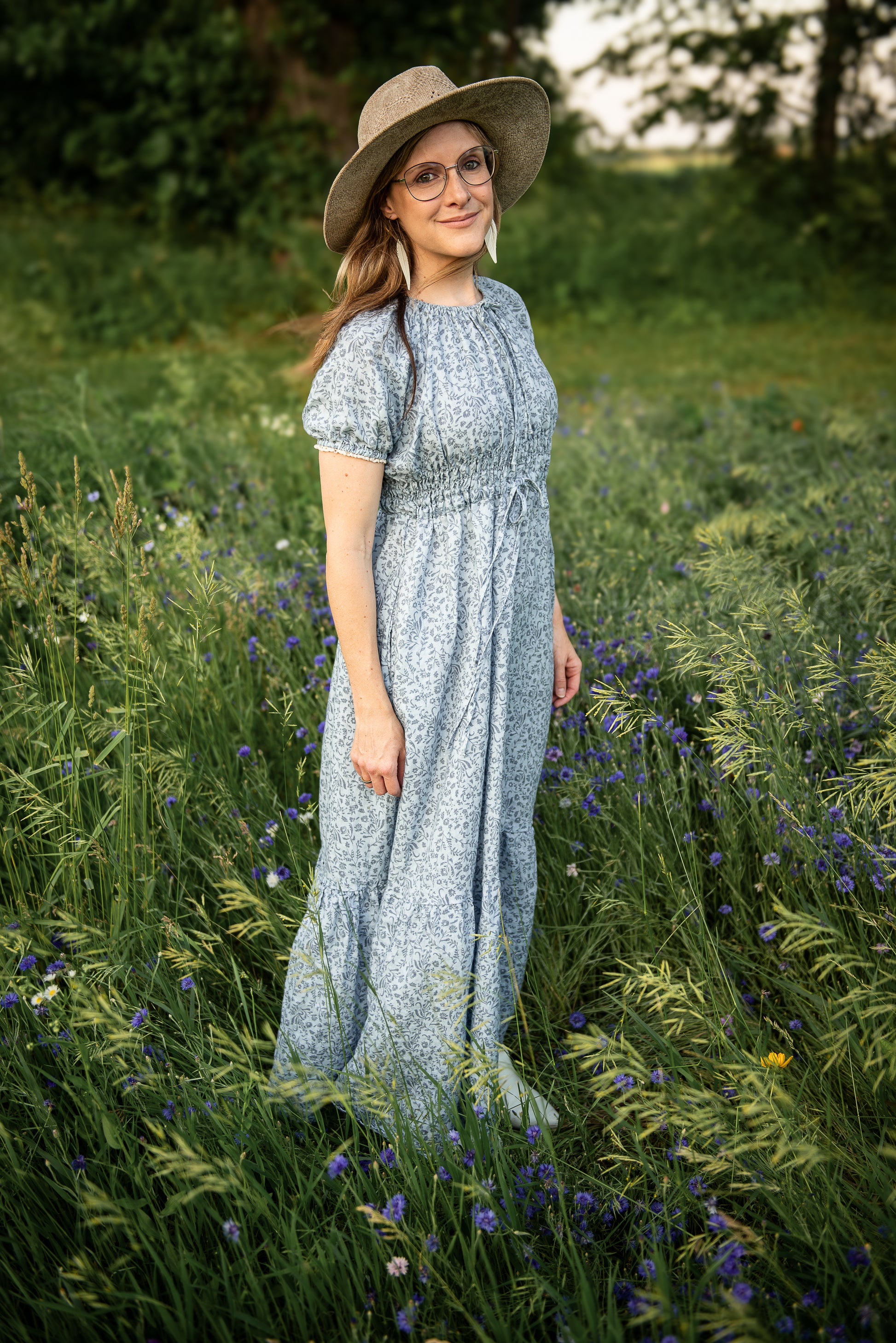 woman in a modest blue nursing dress