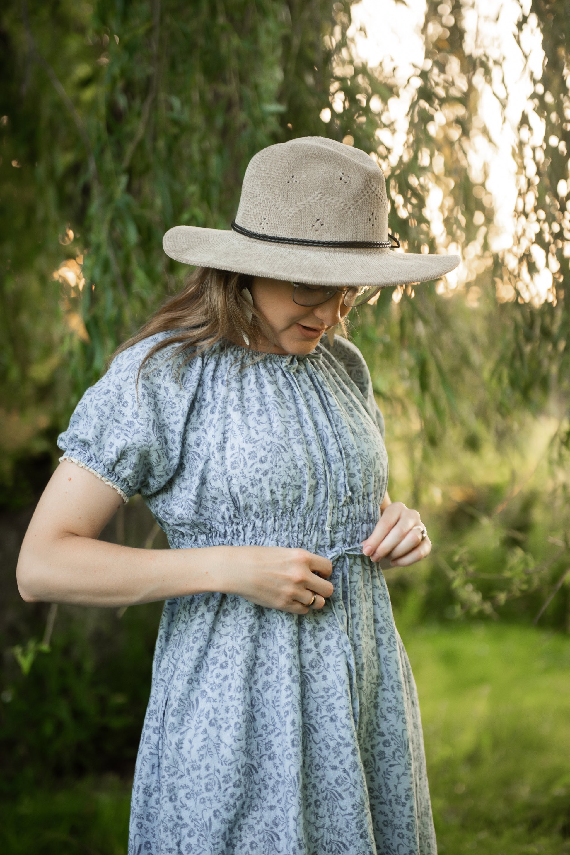 woman in a modest blue nursing dress