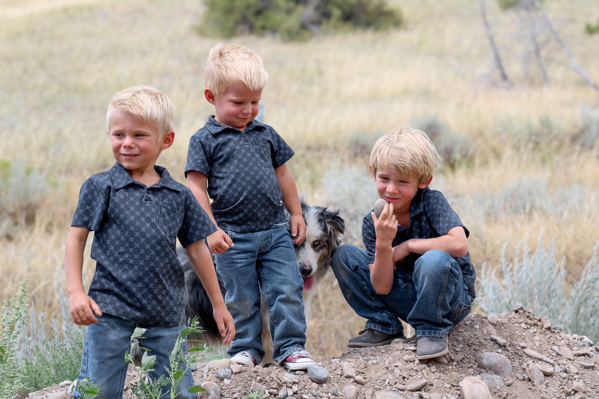 Young boys wearing dark blue polo shirts