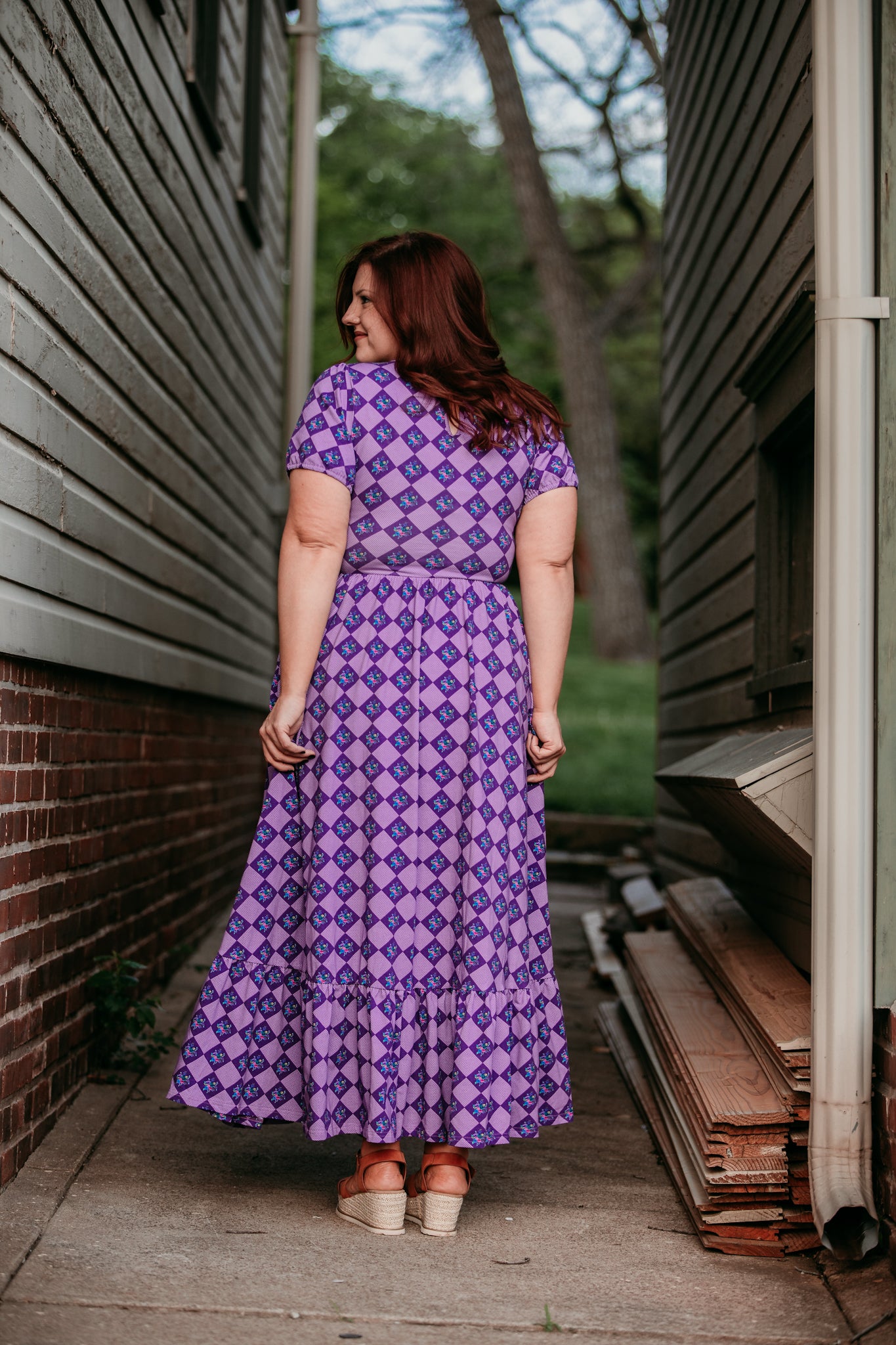 woman wearing patterned purple modest nursing dress