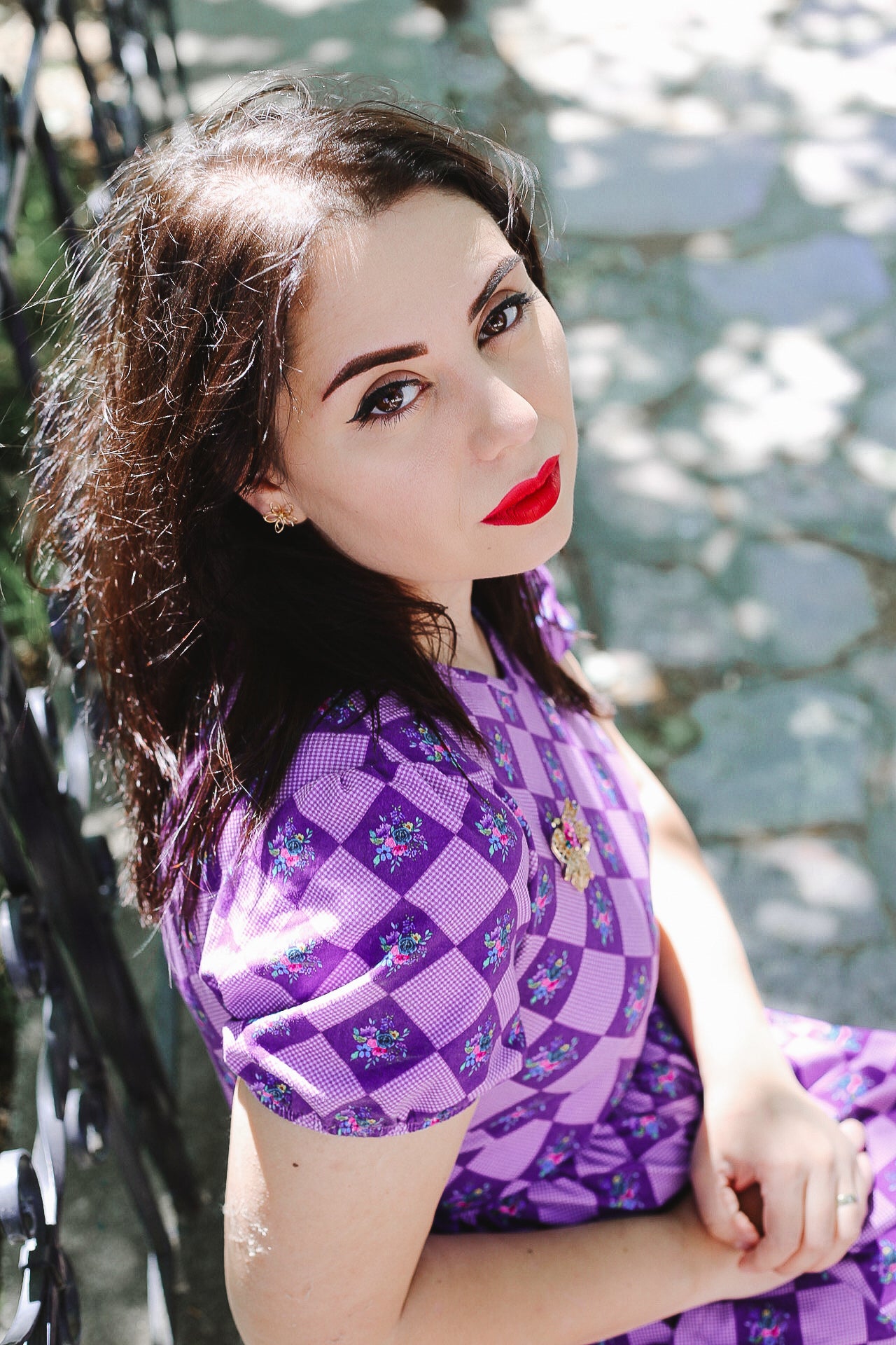 woman wearing patterned purple modest nursing dress