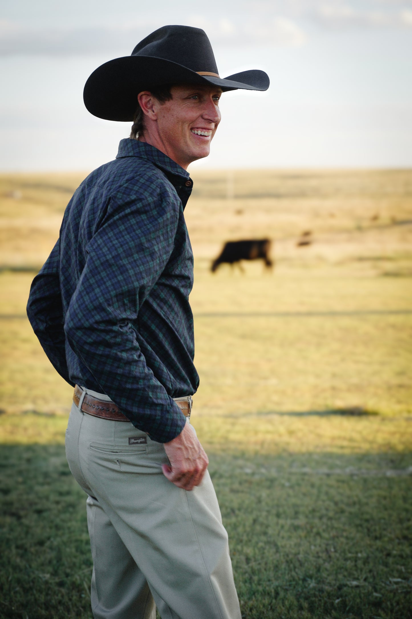 Man in plaid shirt and cowboy hat