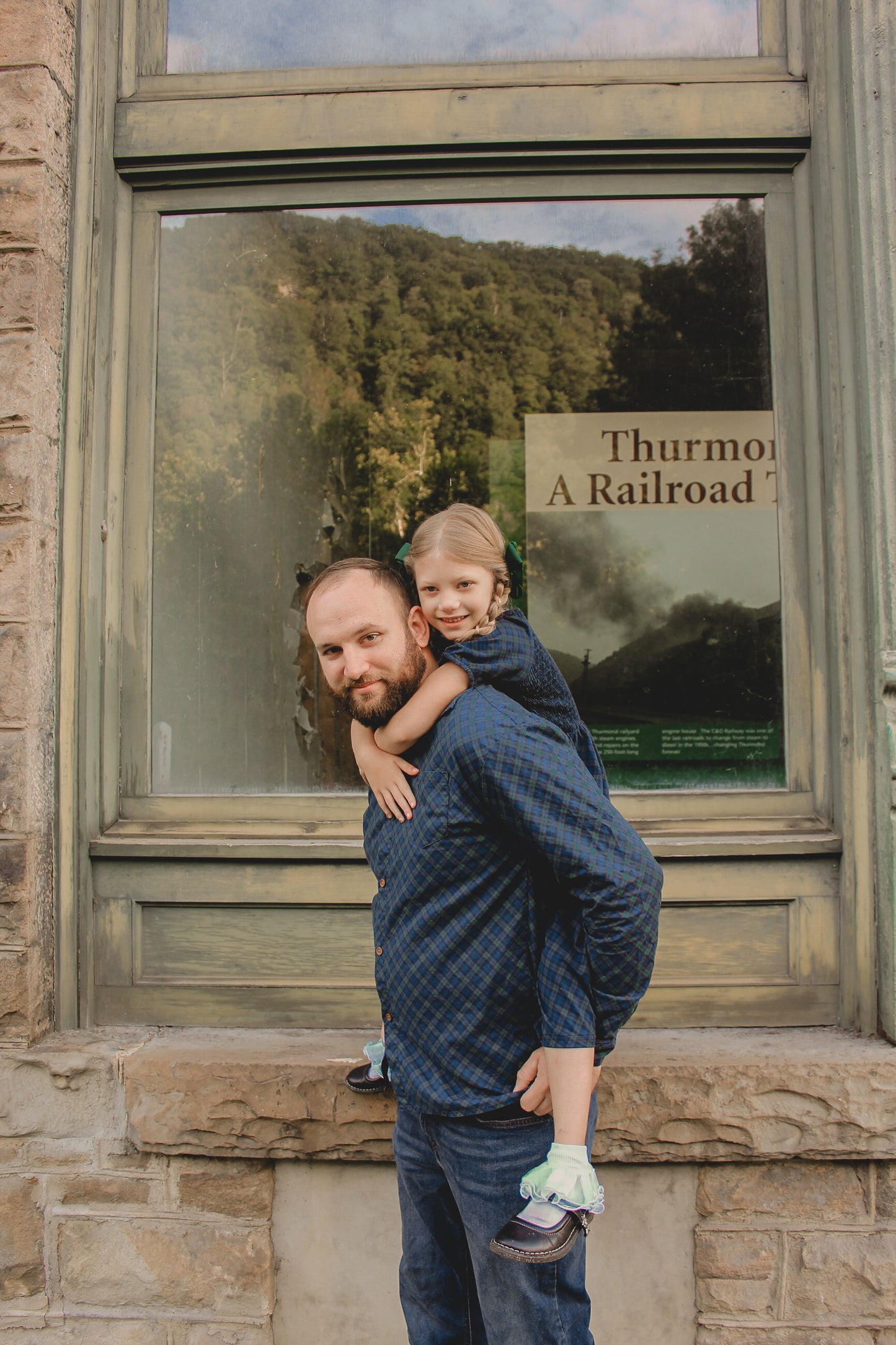 Child being held near window