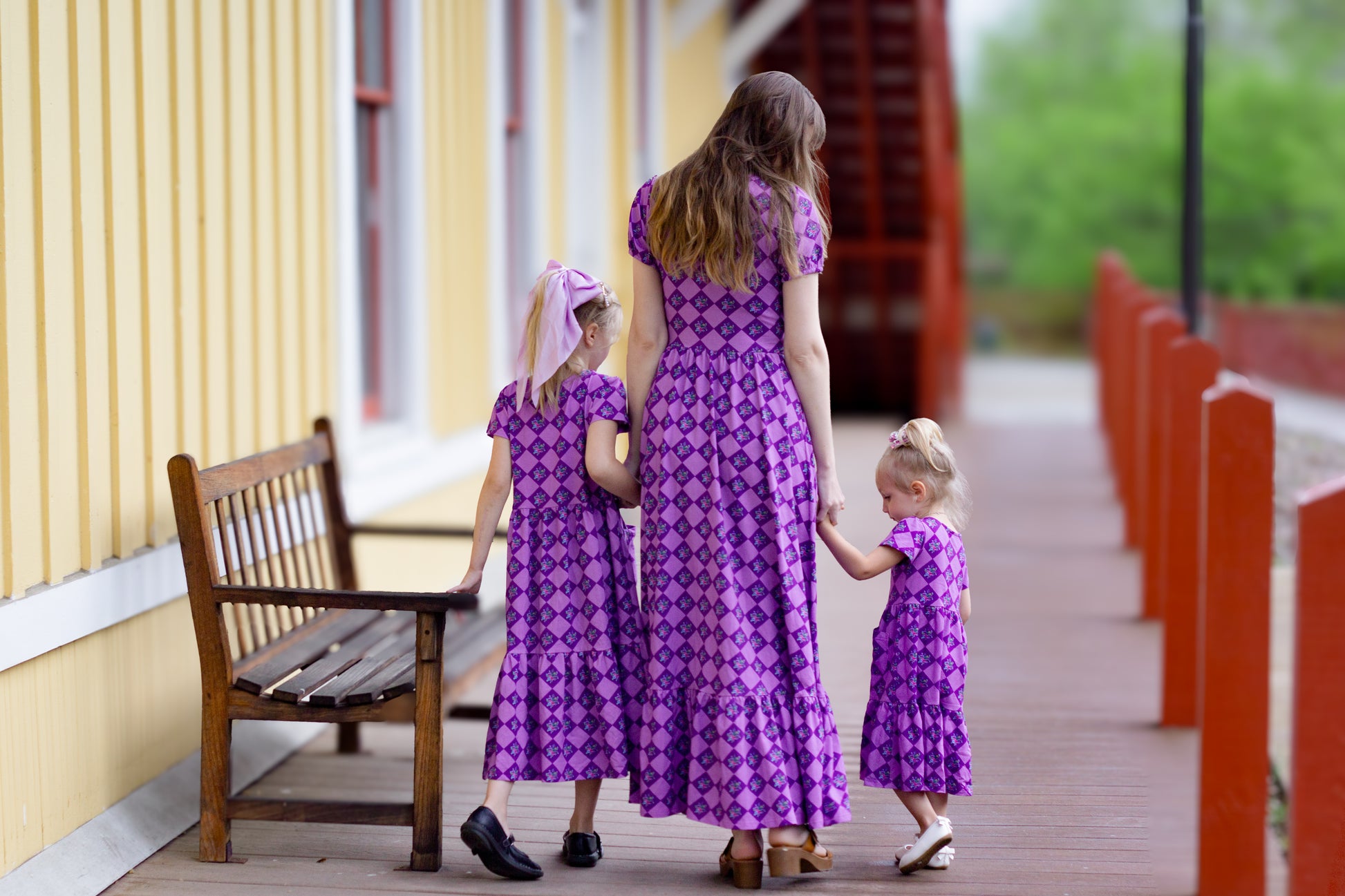 woman wearing patterned purple modest nursing dress