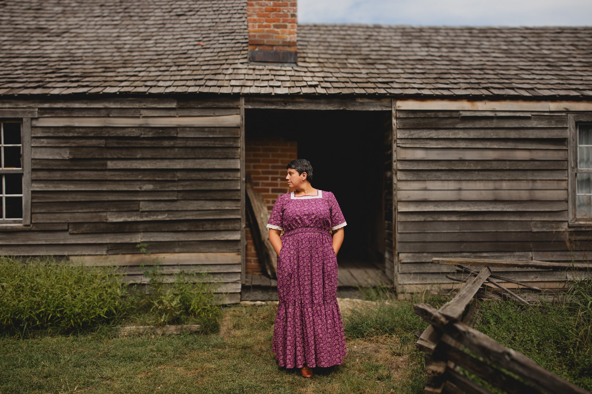 Woman in modest purple nursing dress outdoors