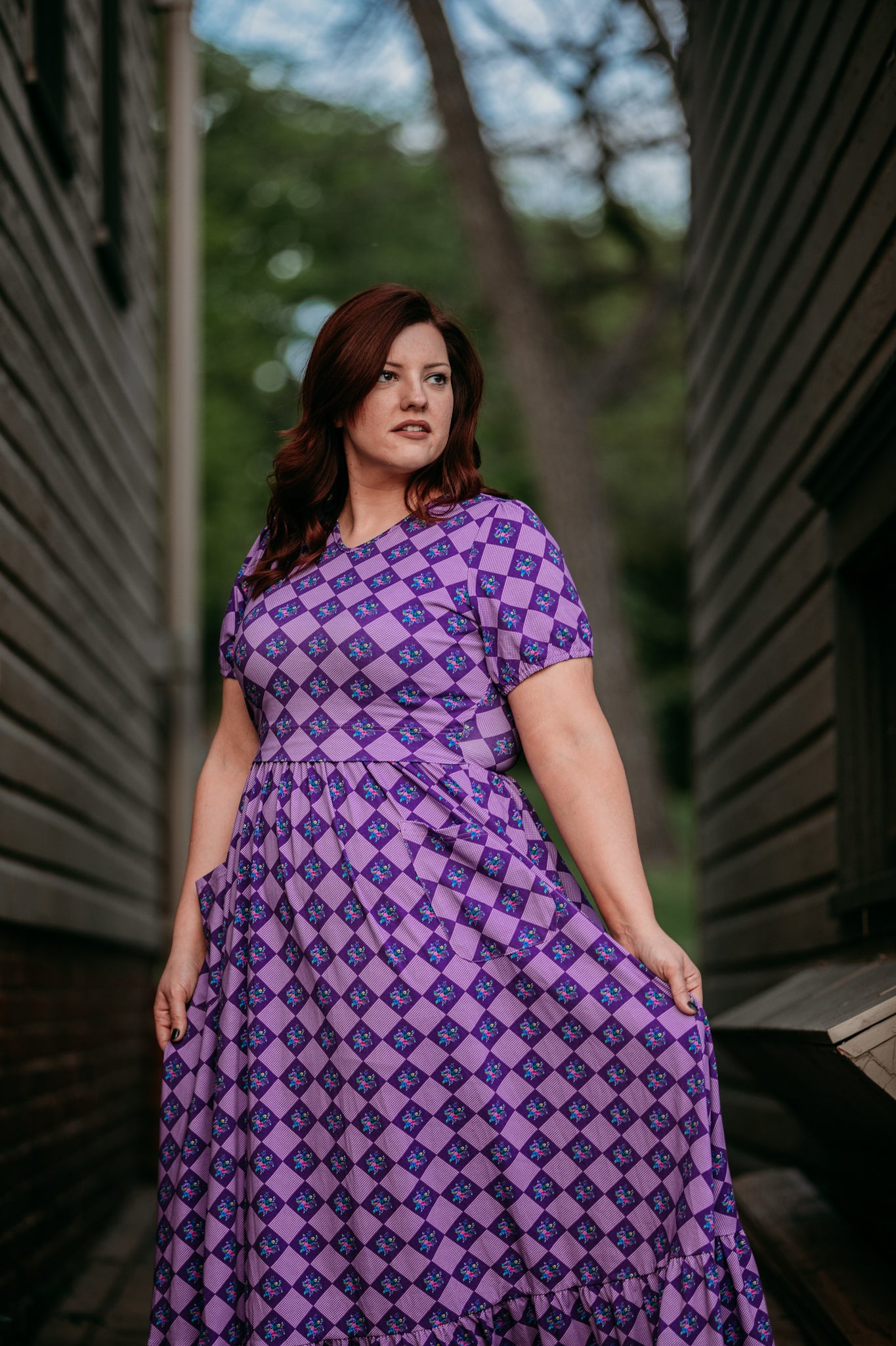woman wearing patterned purple modest nursing dress