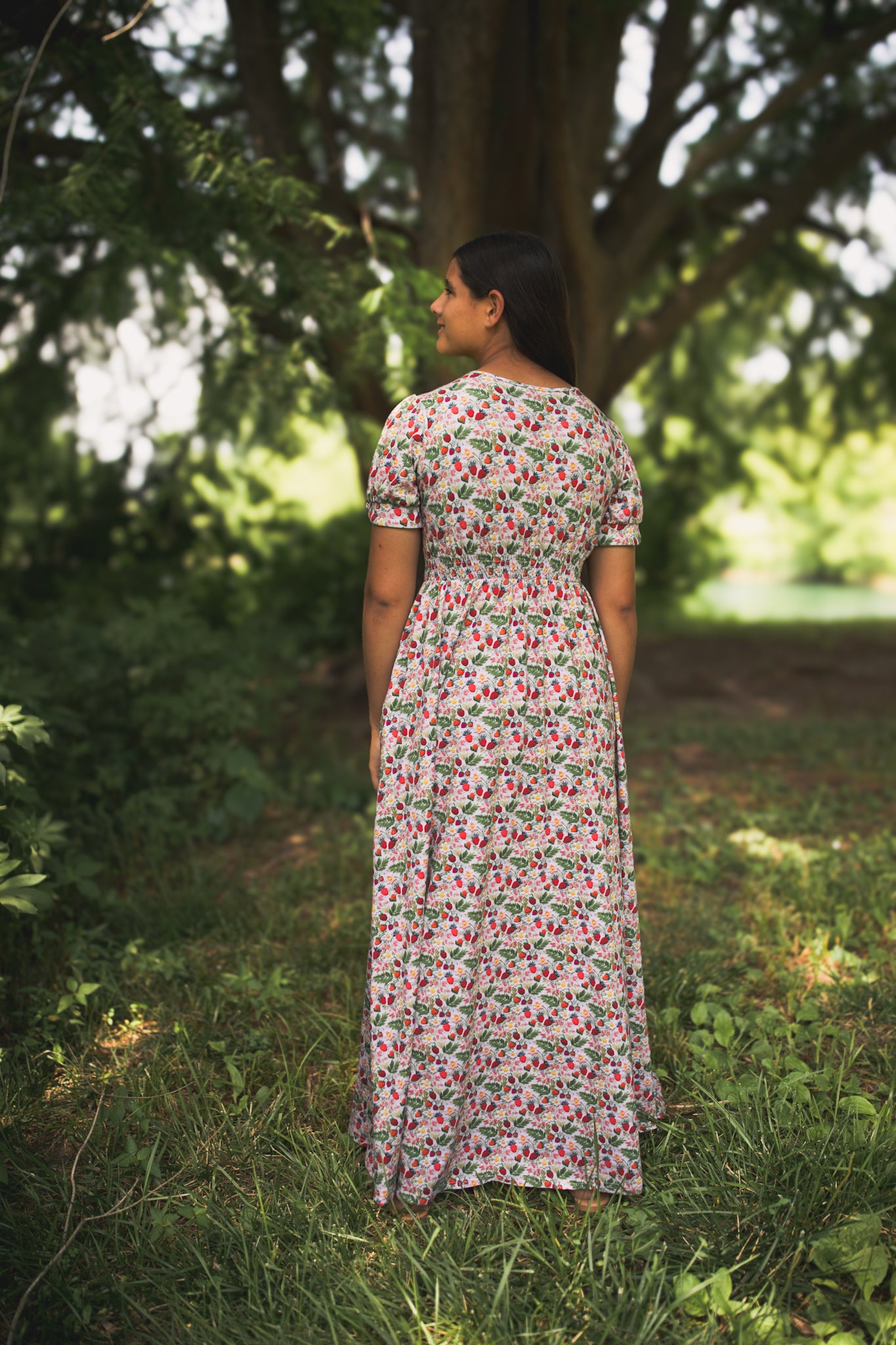 Woman in a floral modest nursing dress.