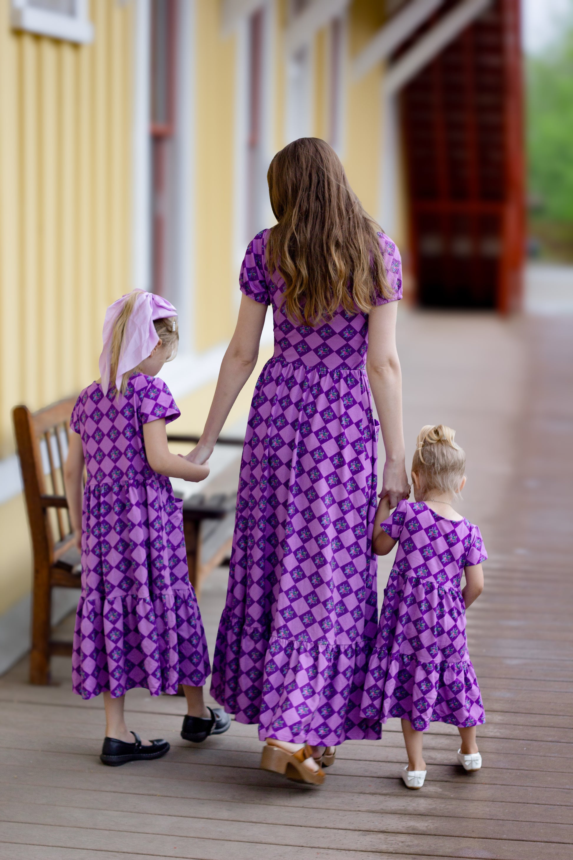 woman wearing patterned purple modest nursing dress