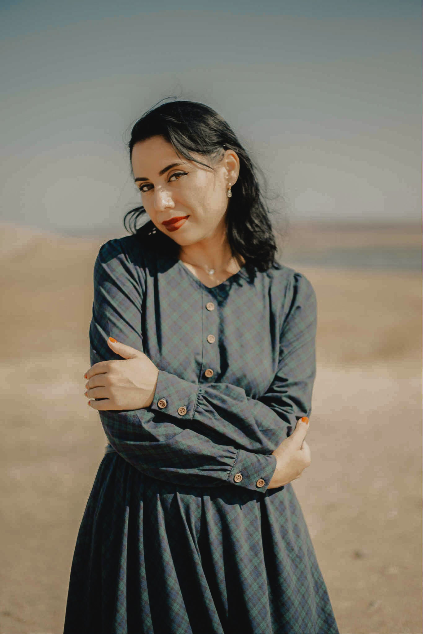 Woman in modest nursing dress desert landscape