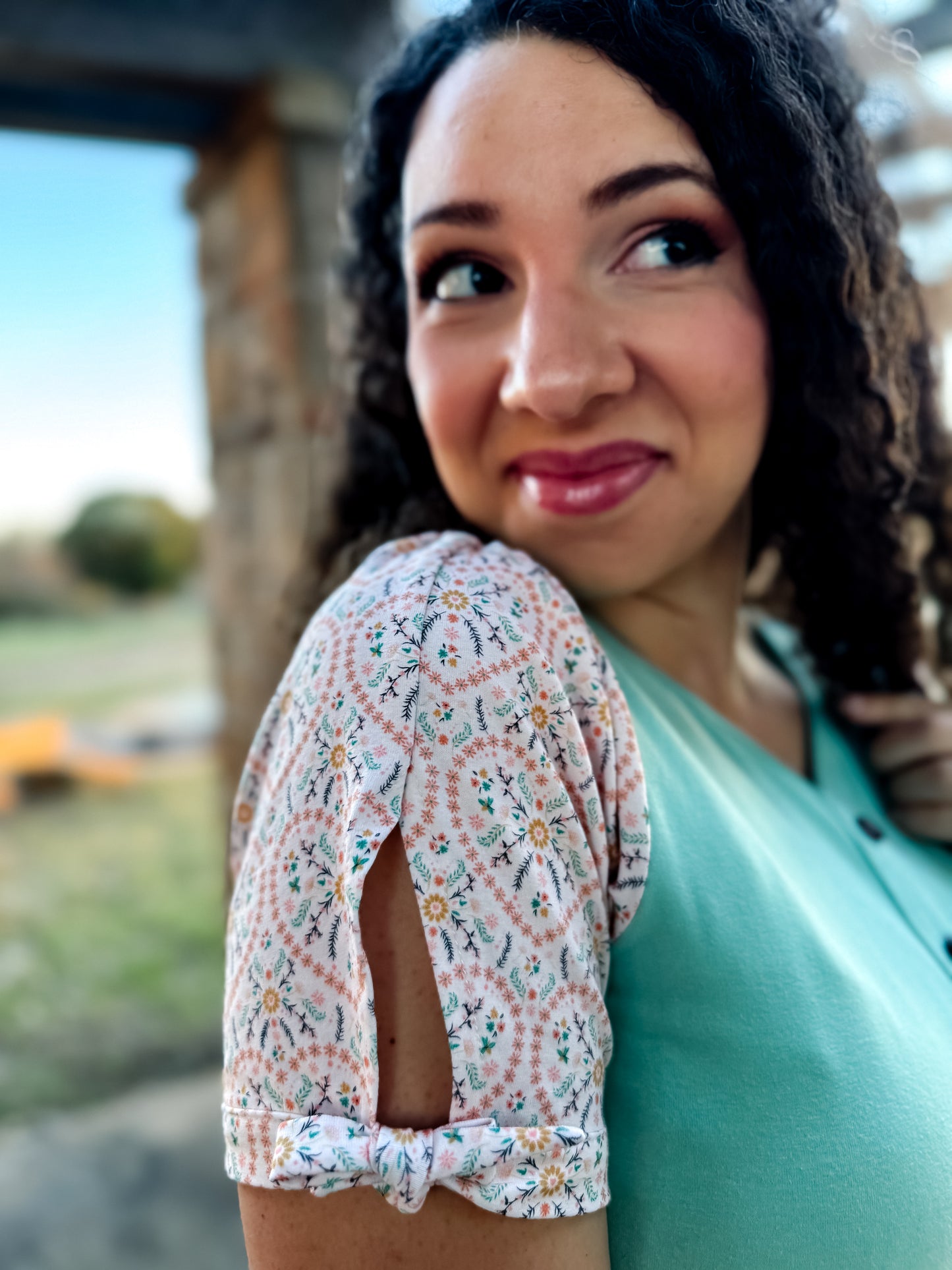 A woman wearing a vintage style modest nursing dress.
