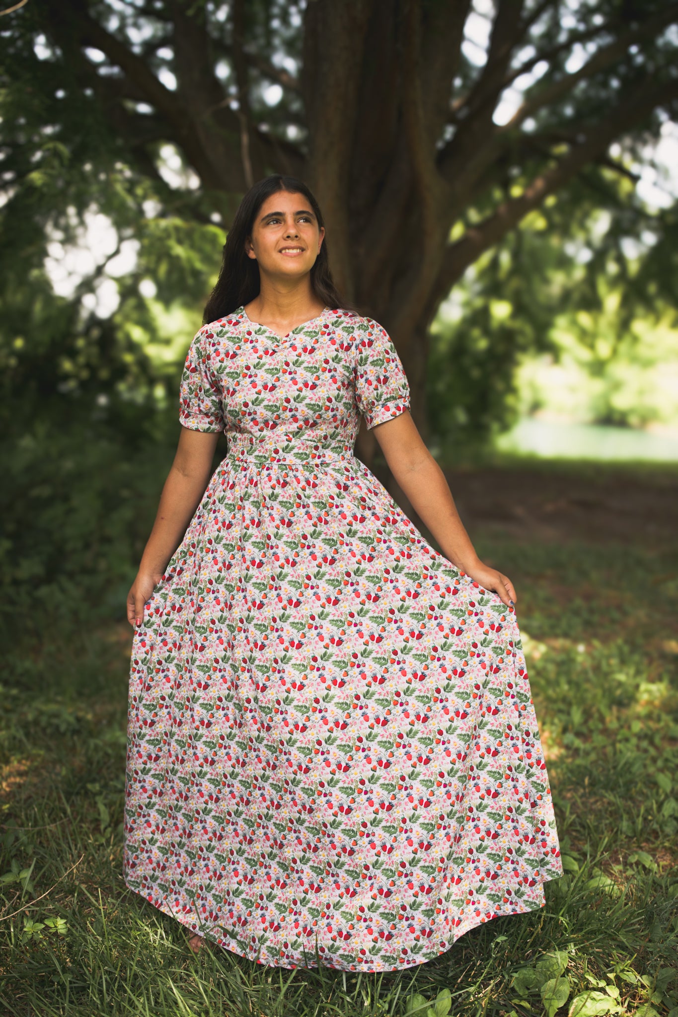Woman in a floral modest nursing dress
