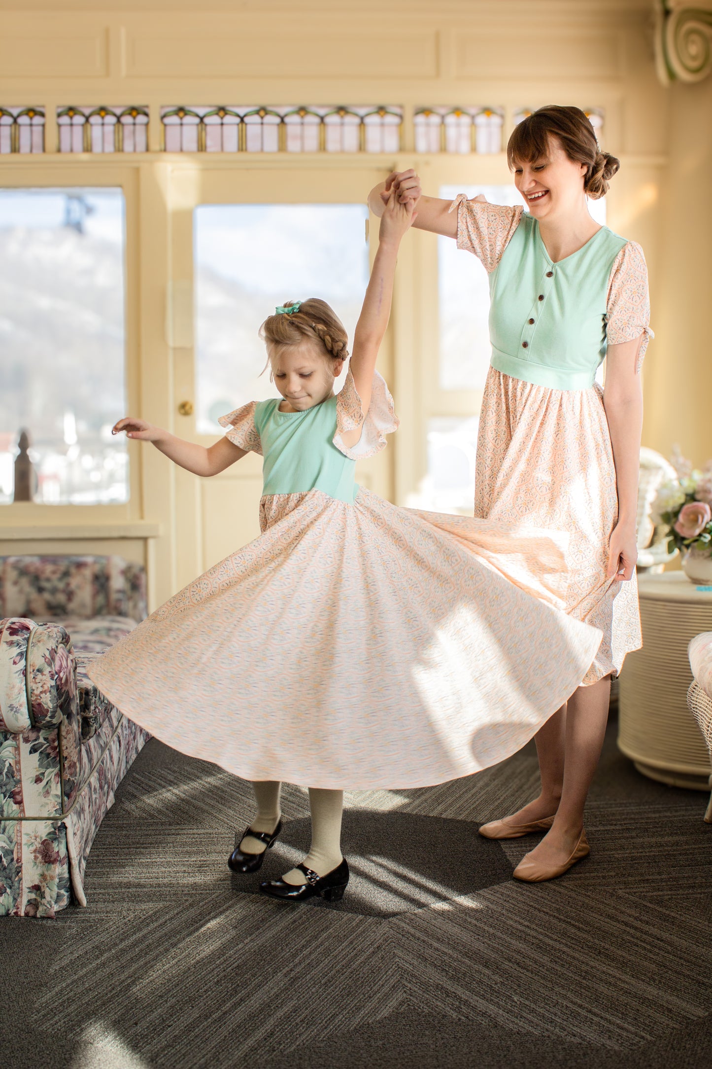Mother and daughter wearing vintage style modest dresses.