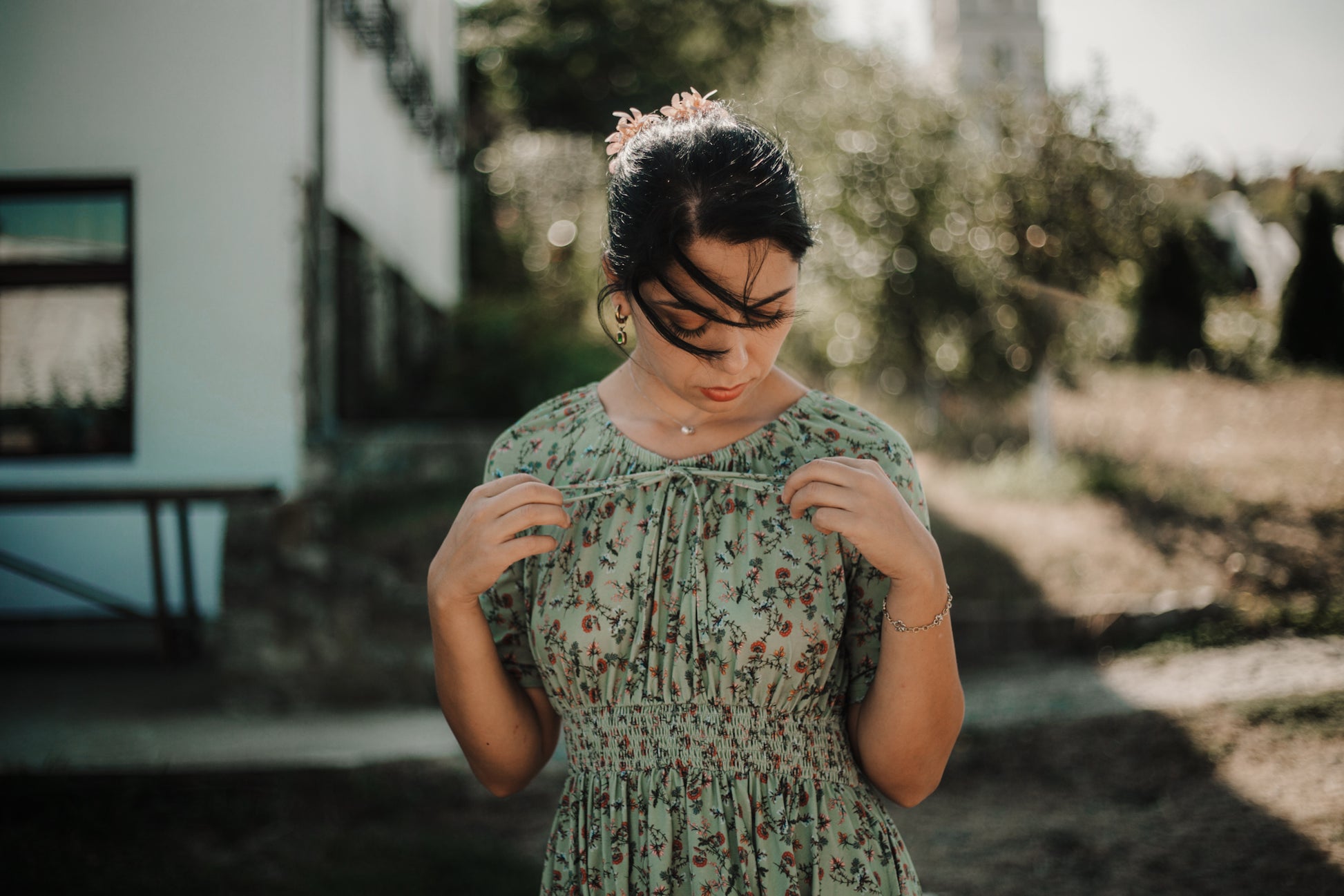 Woman in modest nursing floral dress outdoors