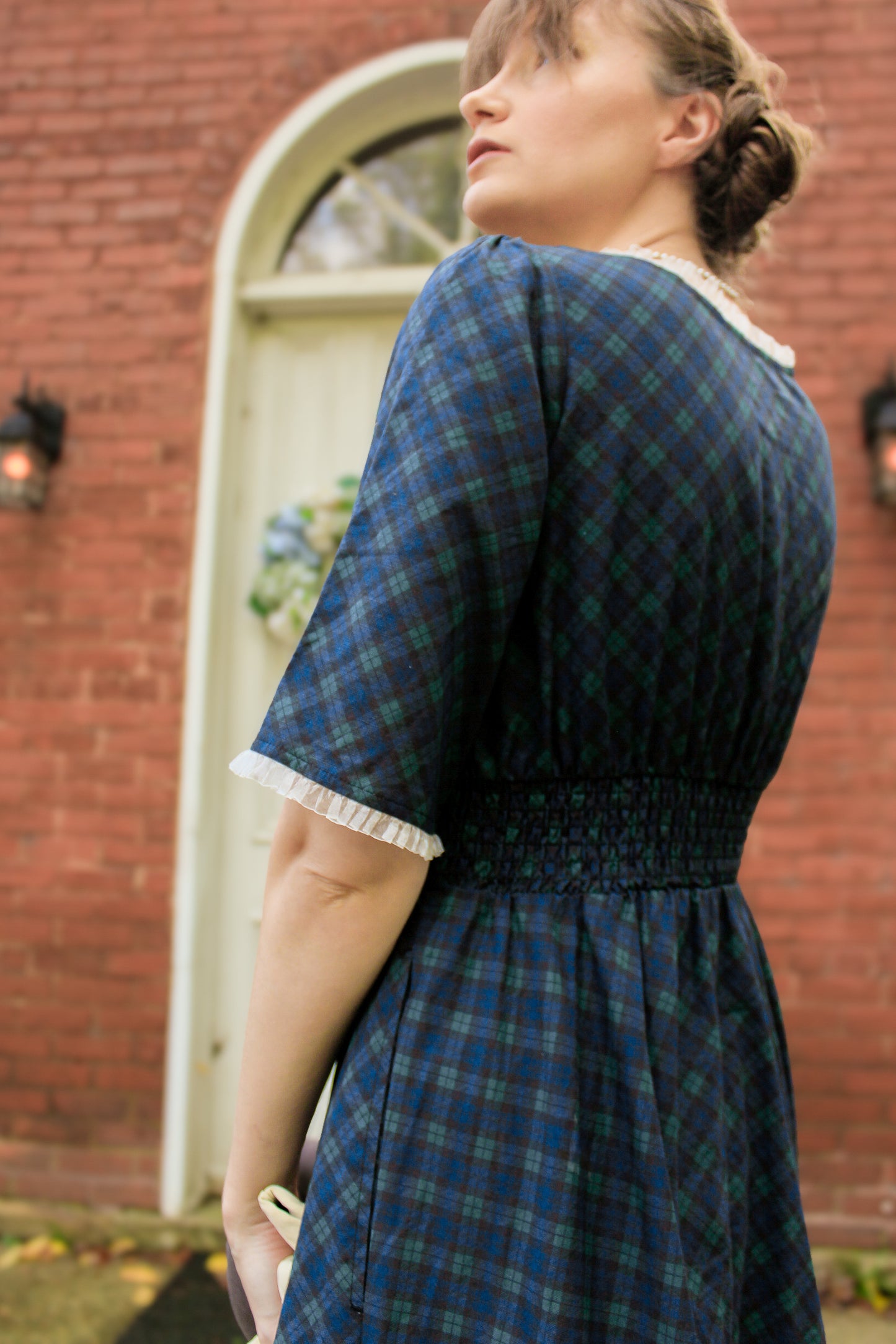 woman wearing a modest nursing blue patterned dress