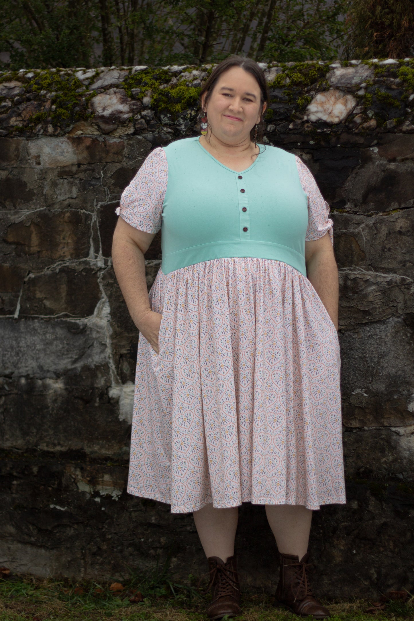 A woman wearing a vintage style modest nursing dress.