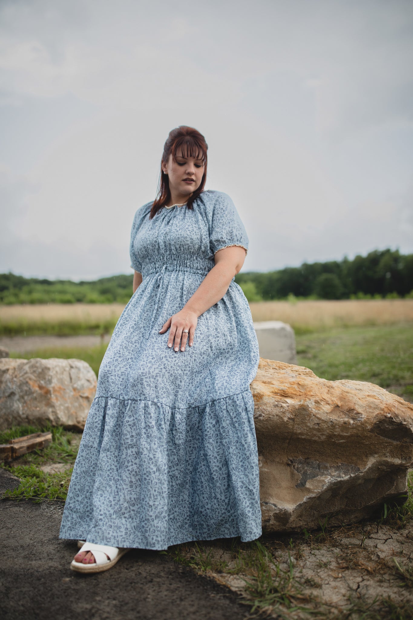 woman in a modest blue nursing dress