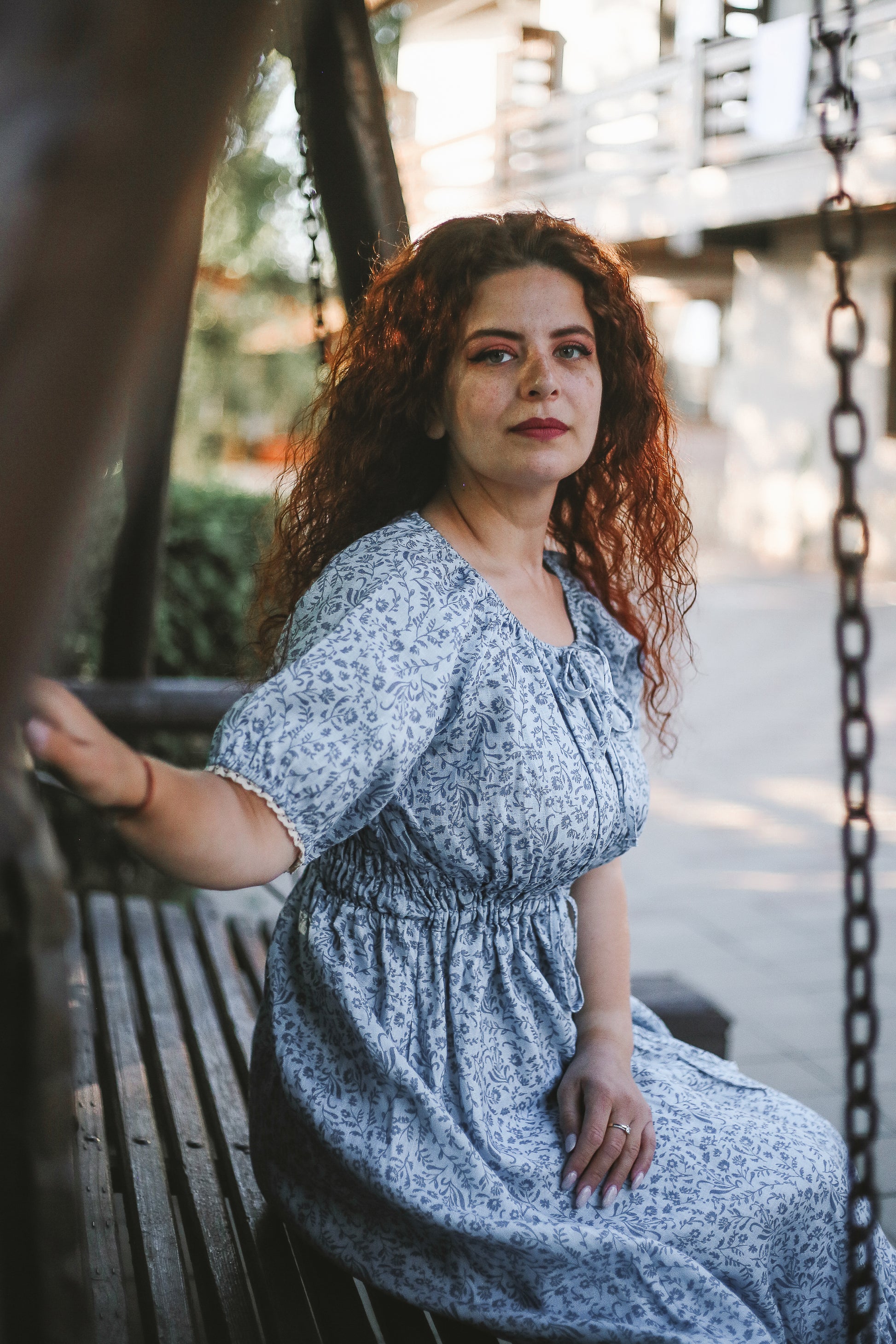 woman in a modest blue nursing dress