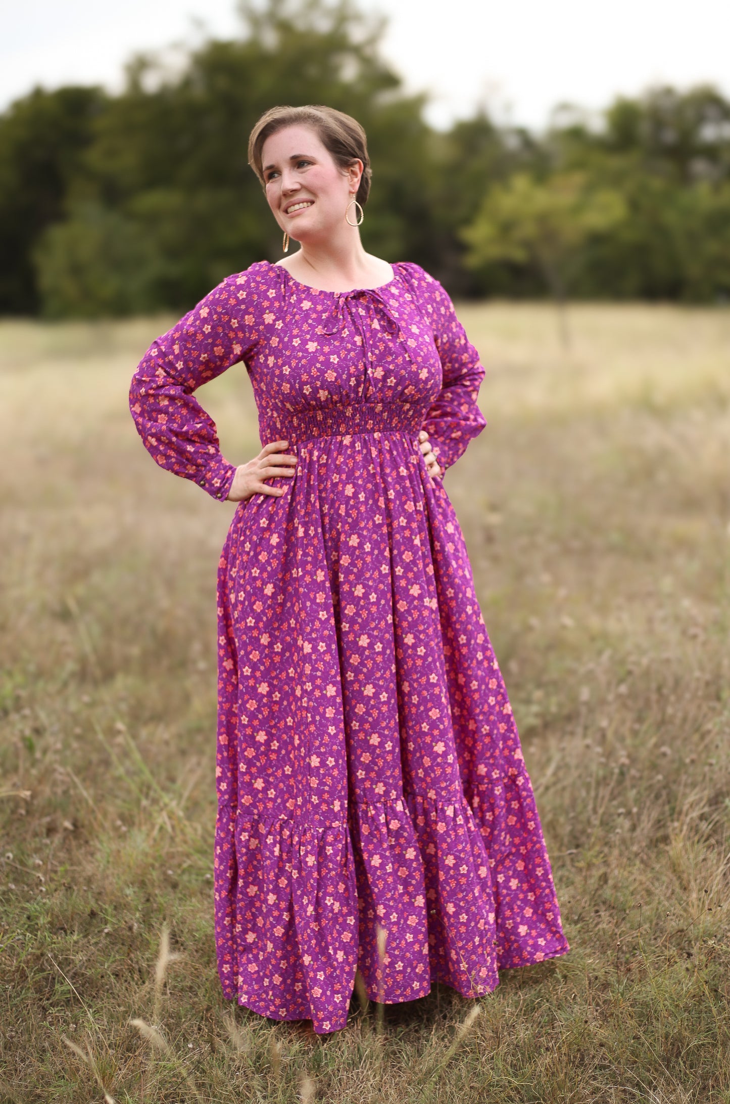 Woman in modest purple nursing dress outdoors