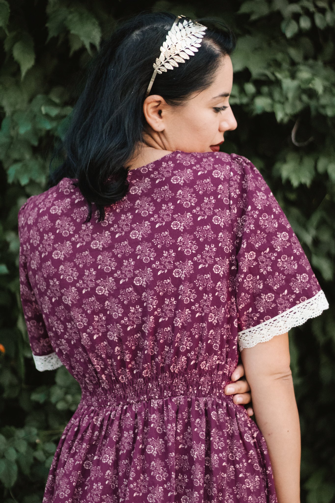 Woman in modest purple floral nursing dress outdoors