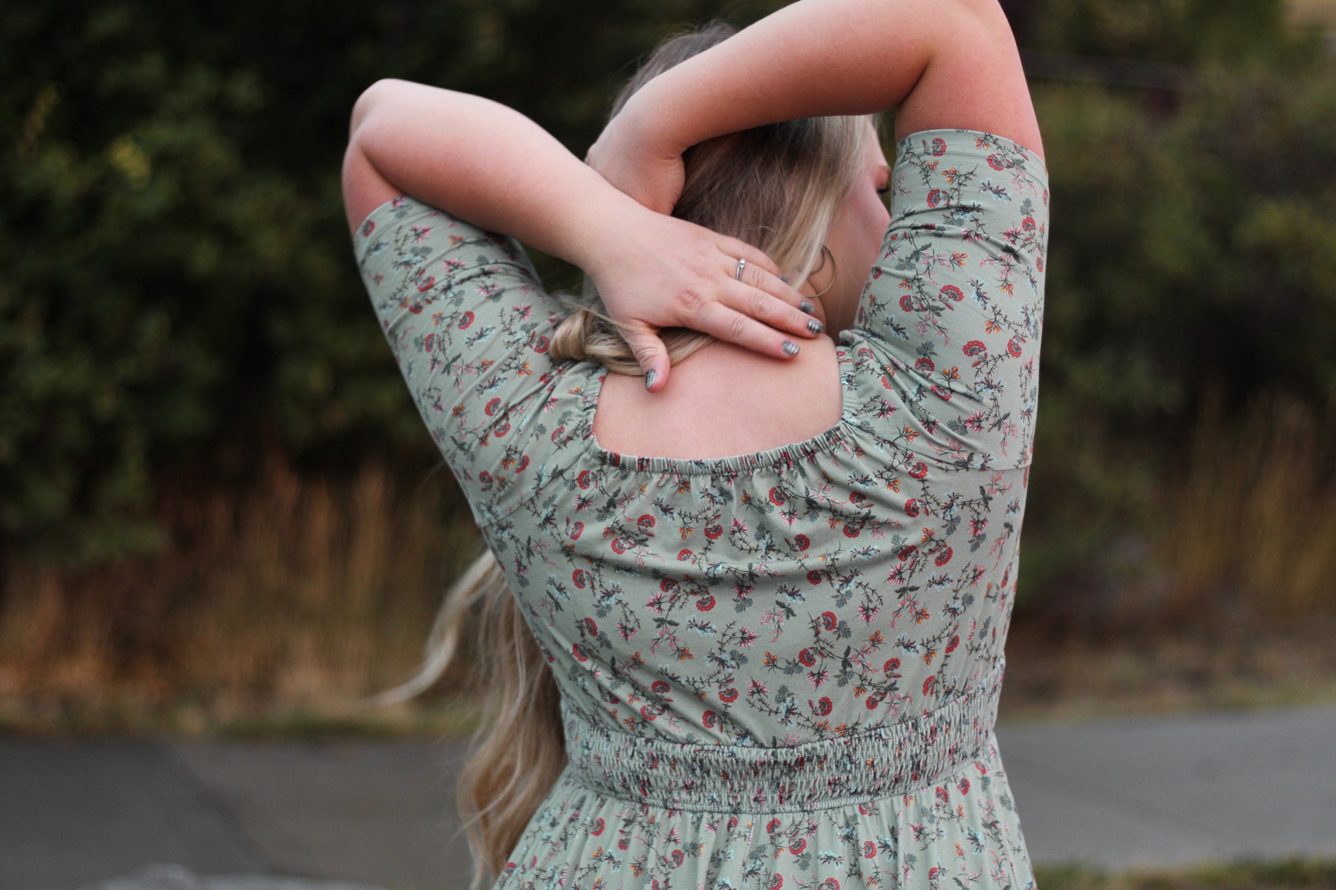 Woman in modest nursing floral dress outdoors