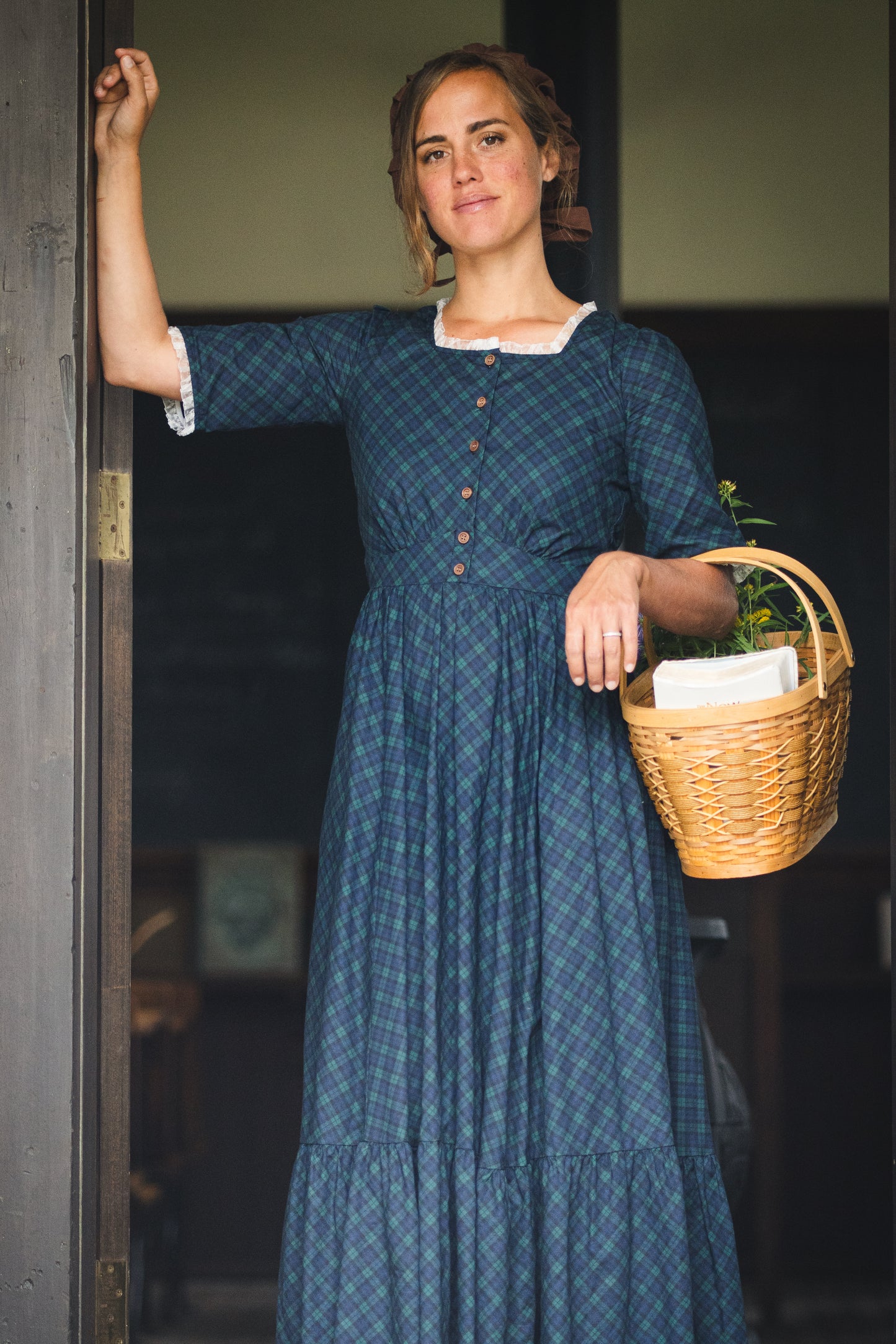 woman wearing a modest nursing blue patterned dress