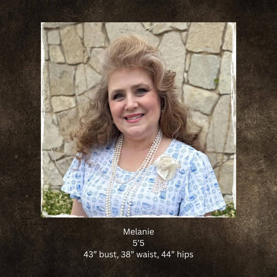 woman wearing a vintage-style green and white modest nursing dress