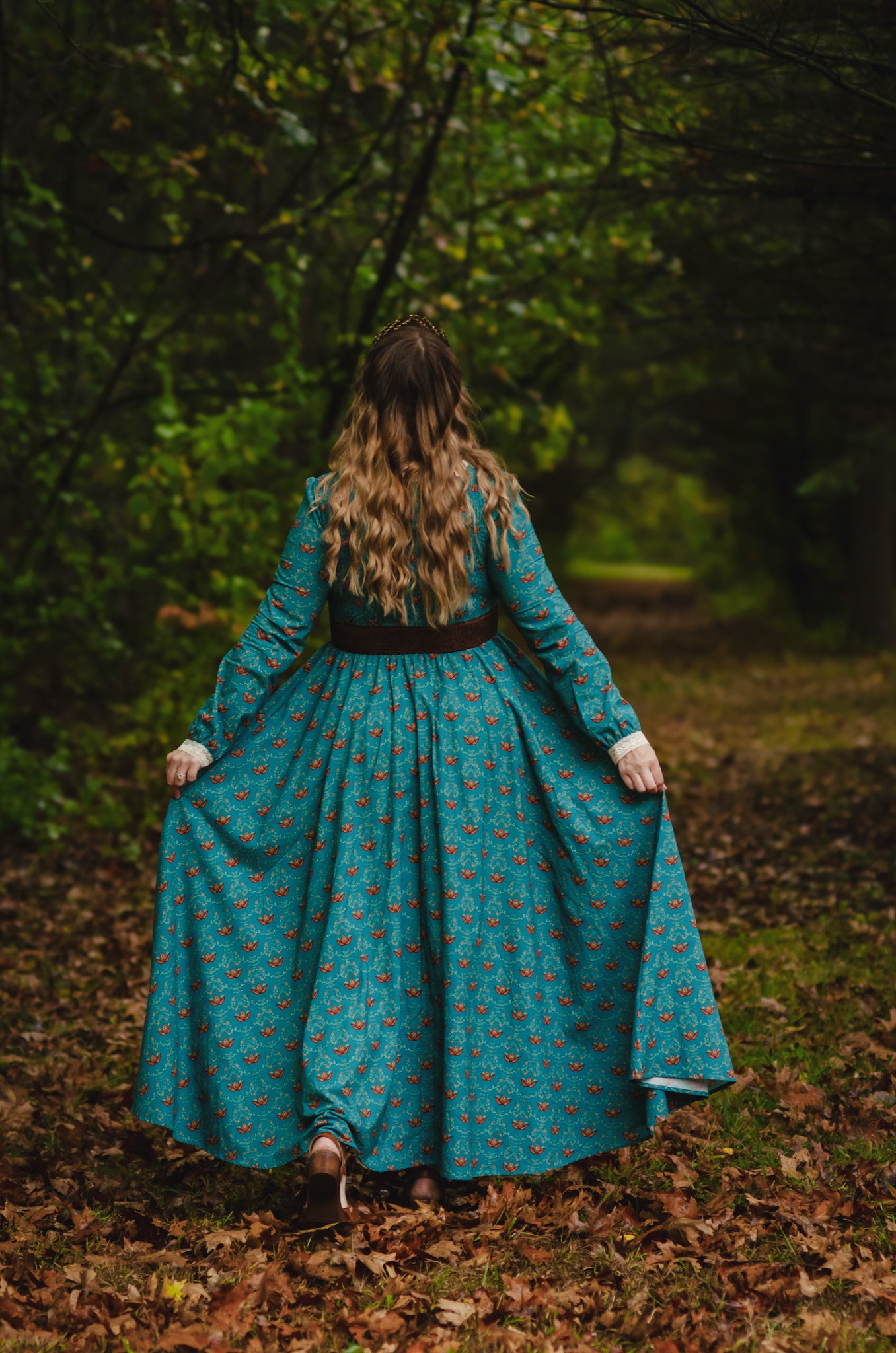 Woman in modest nursing teal floral dress walking
