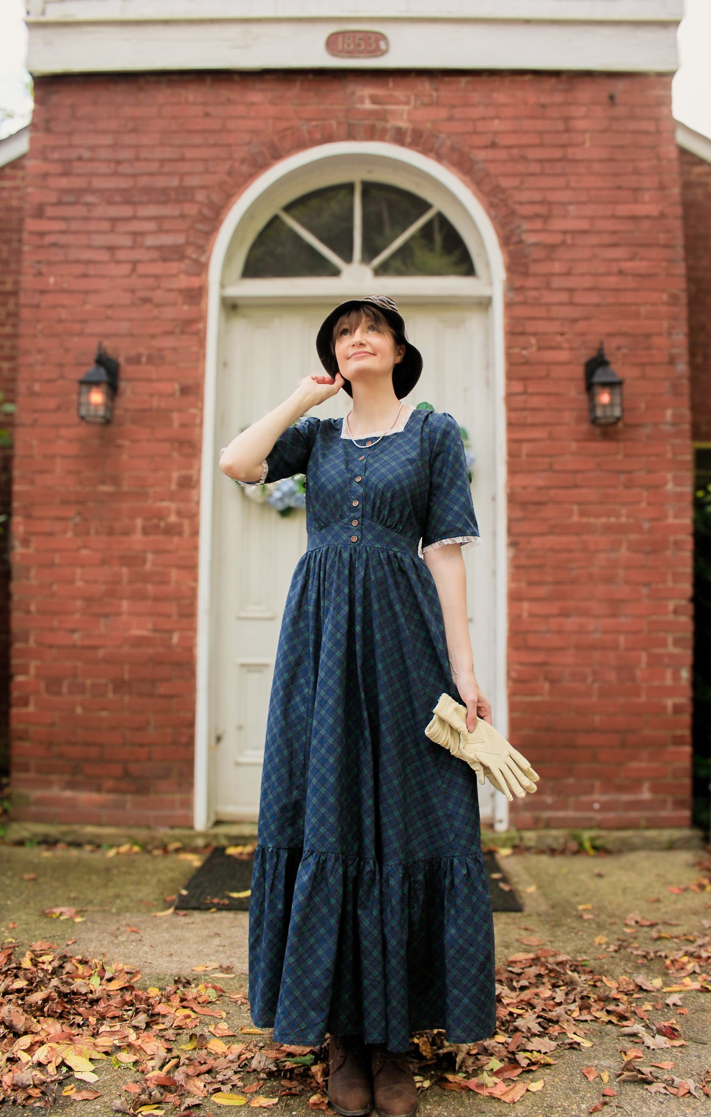 woman wearing a modest nursing blue patterned dress