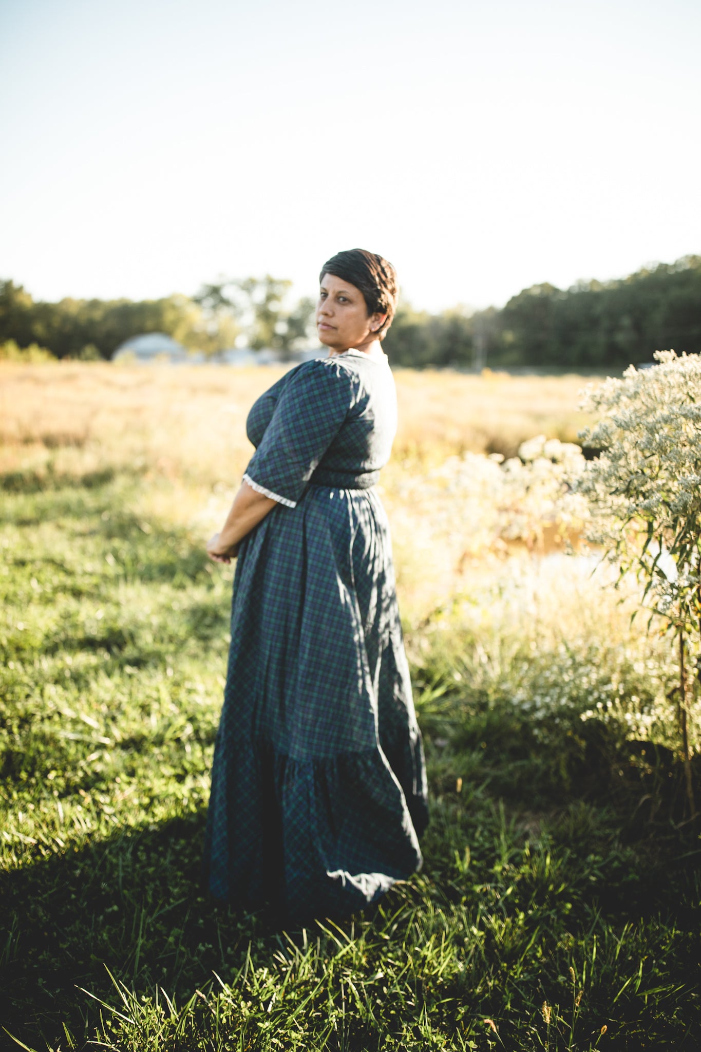 woman wearing a modest nursing blue patterned dress