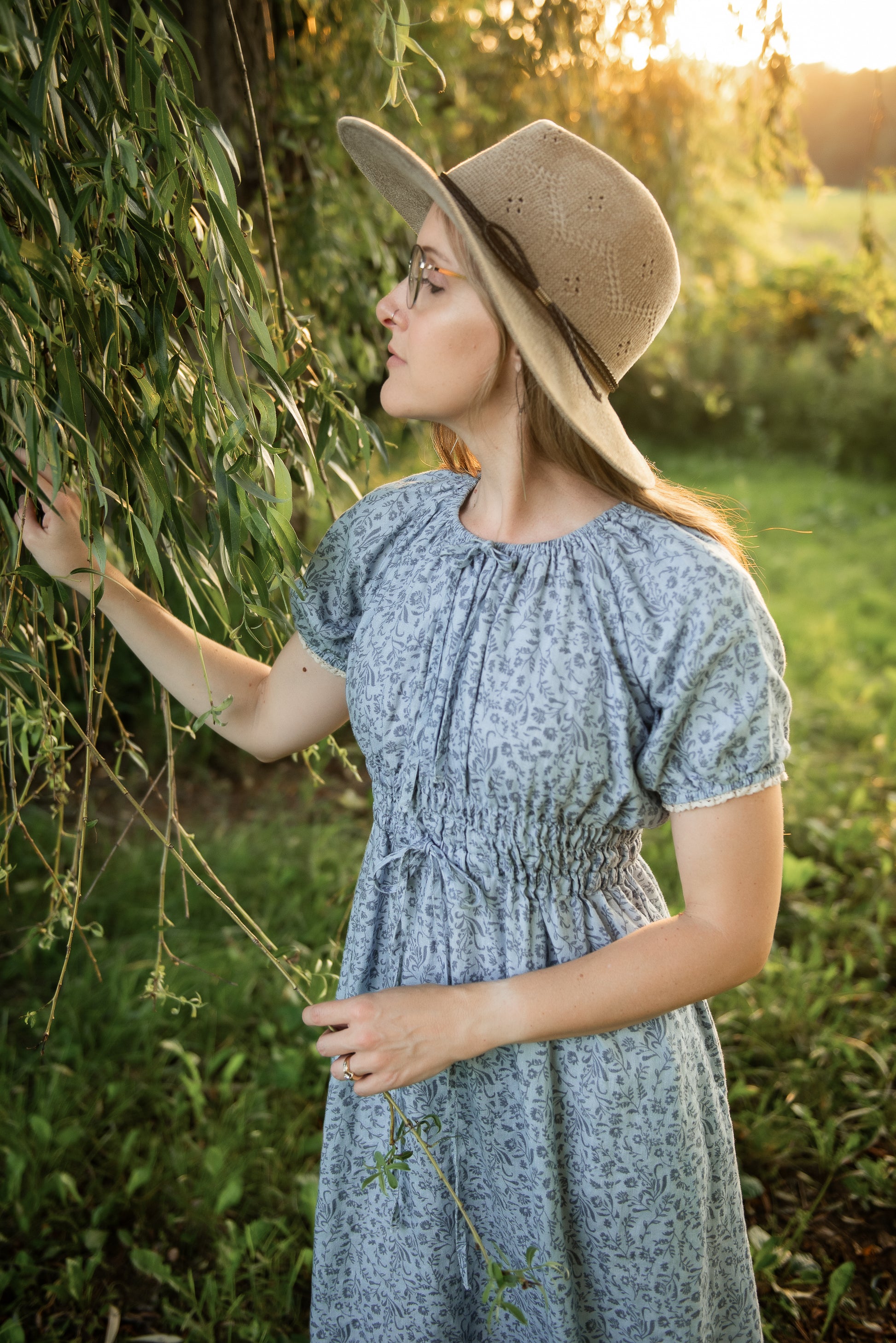 woman in a modest blue nursing dress