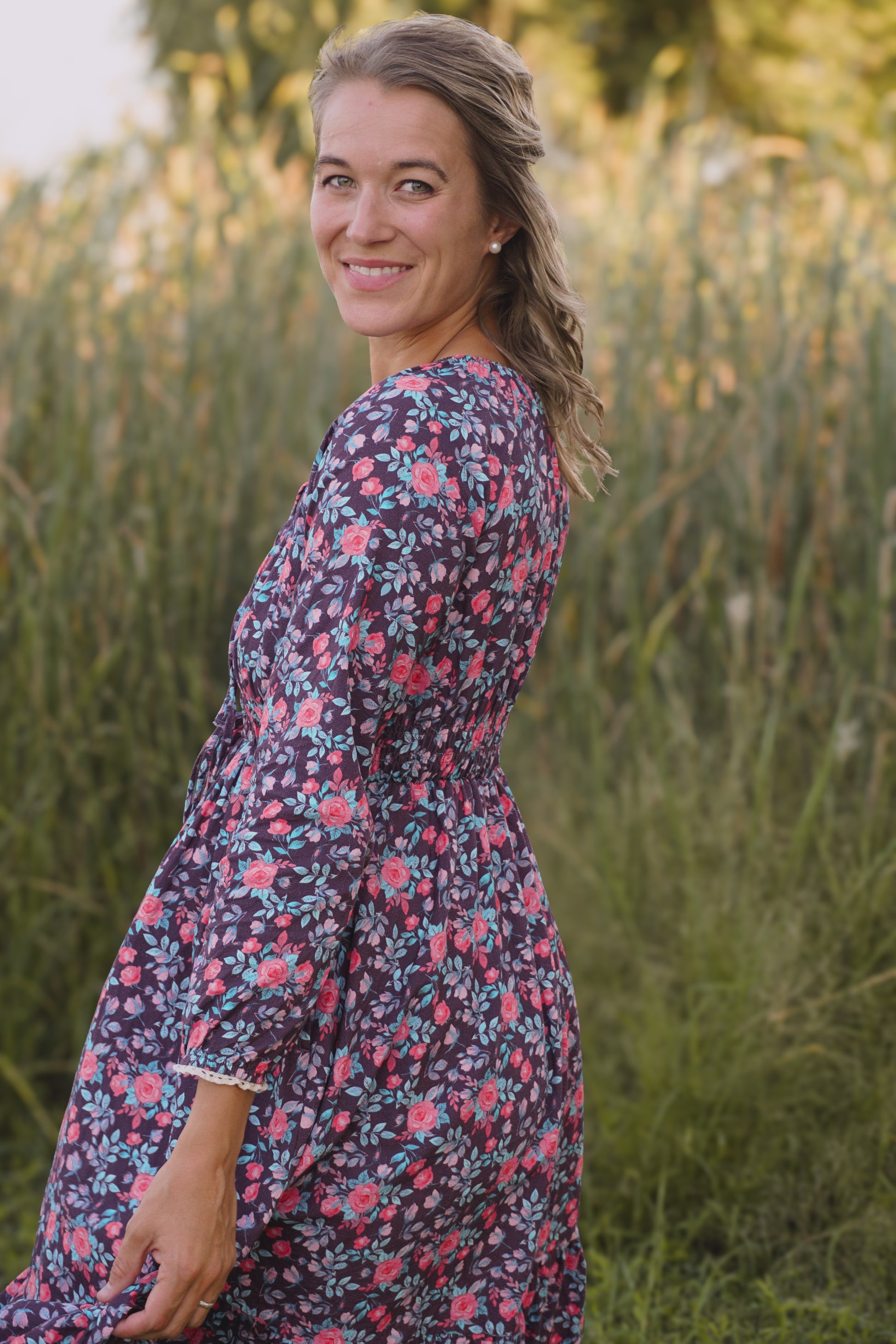Woman in modest nursing floral dress outdoors