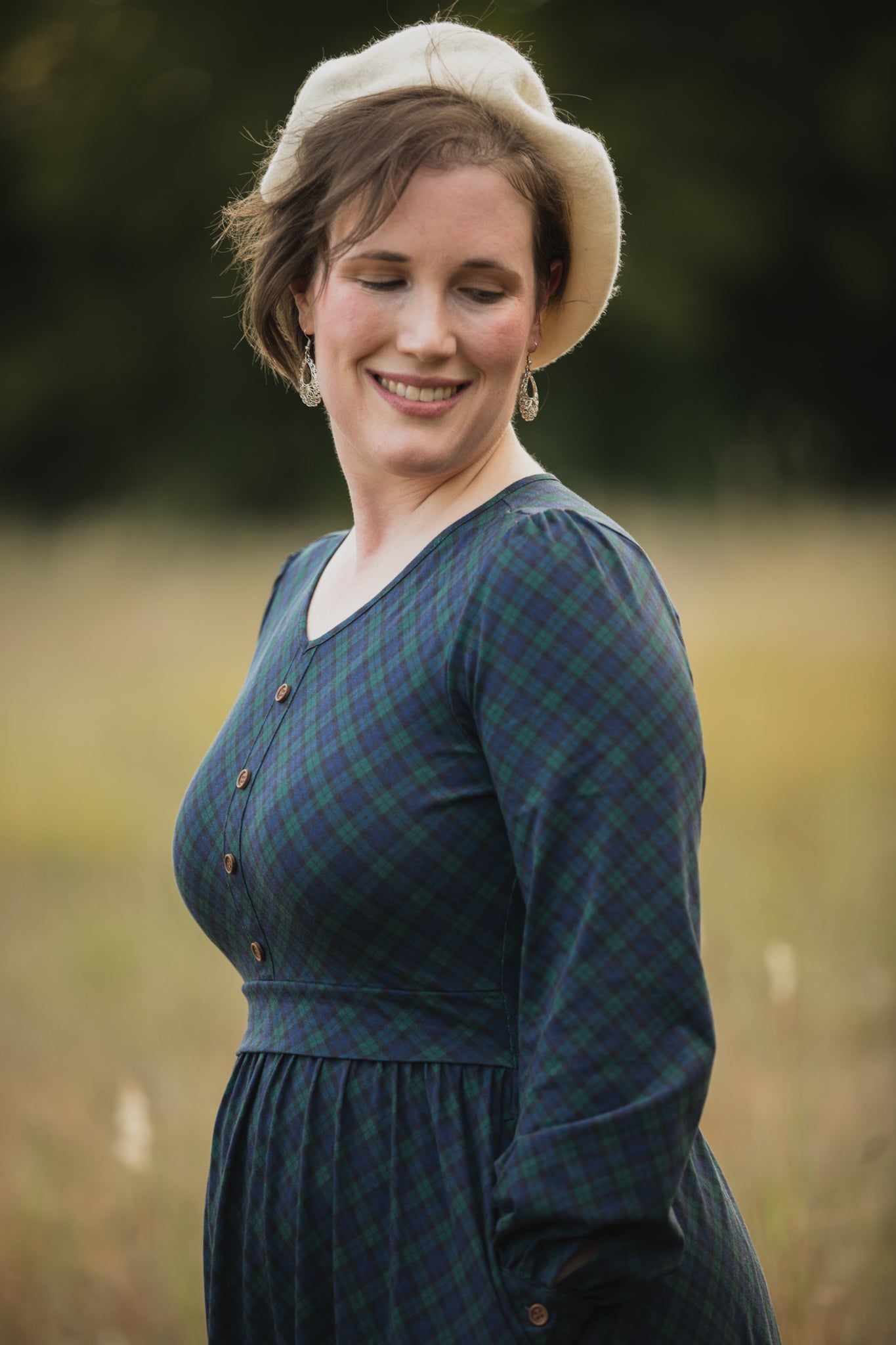 Woman in modest nursing blue plaid dress hat