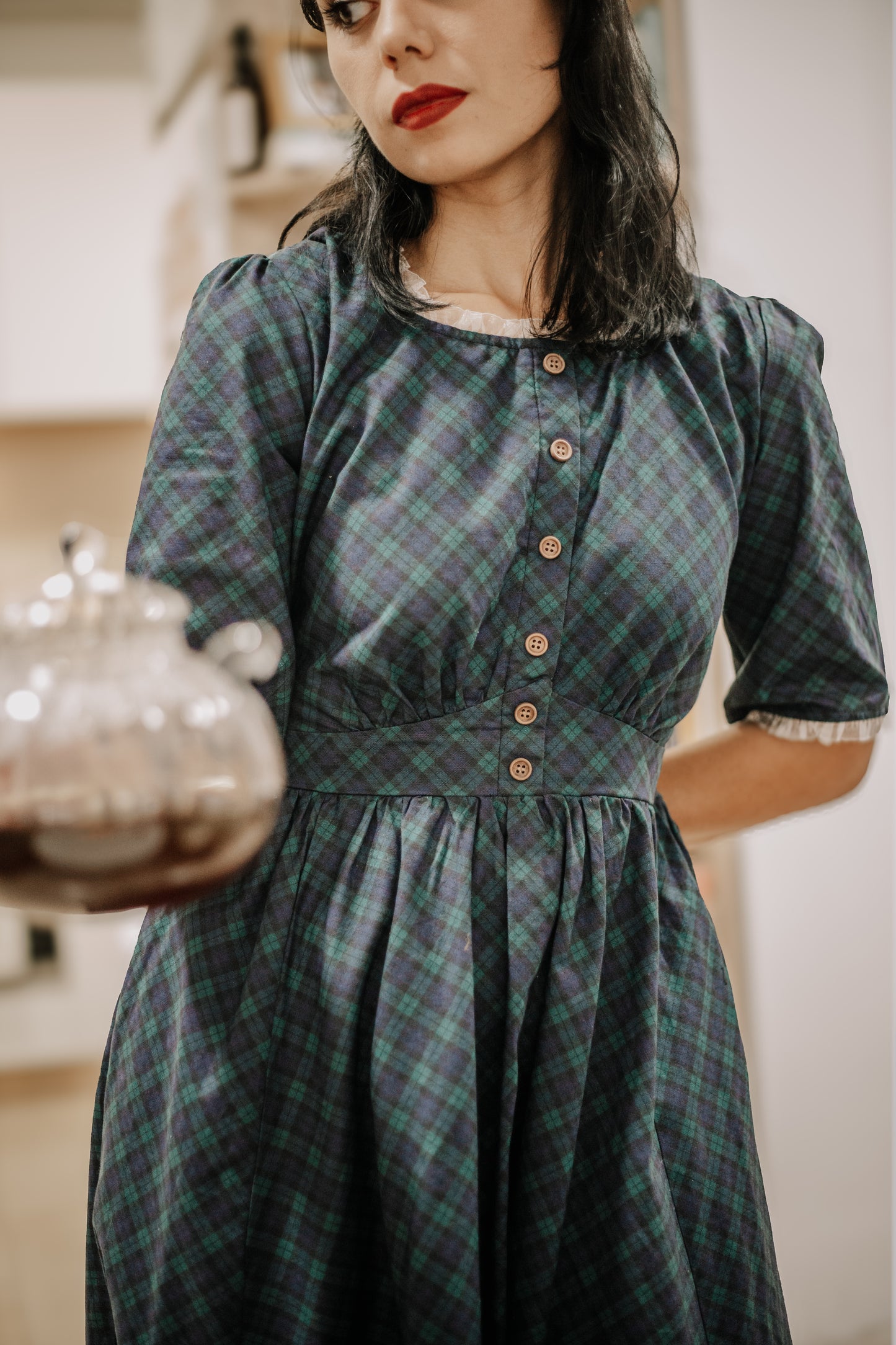 woman wearing a modest nursing blue patterned dress
