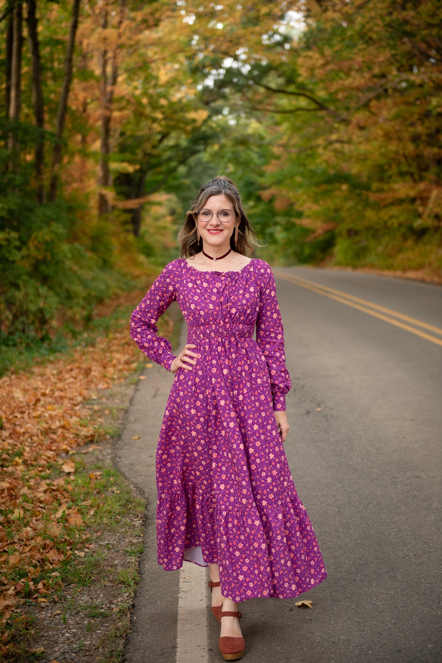 Woman in modest purple nursing dress outdoors