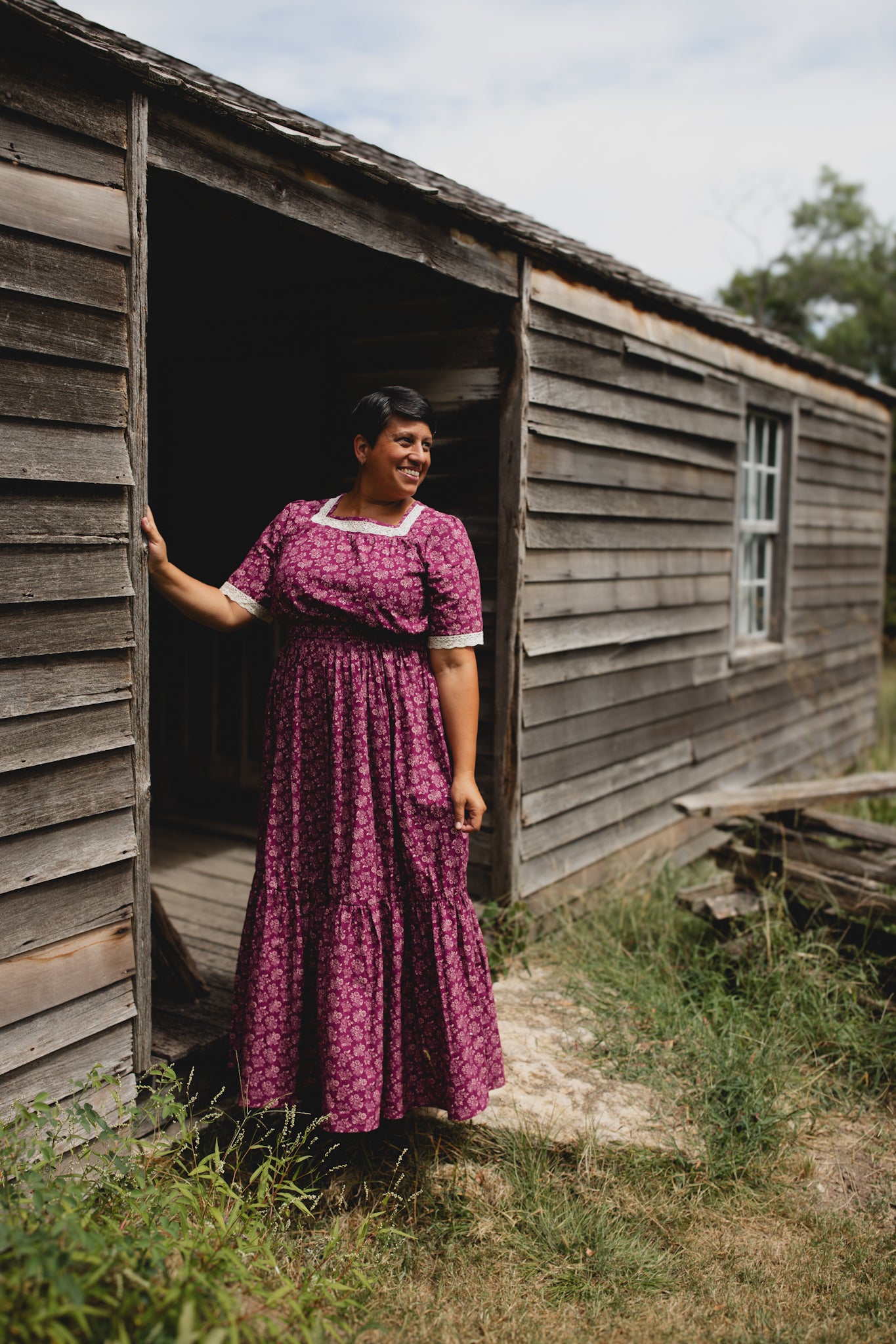Woman in modest nursing dress with purple floral print
